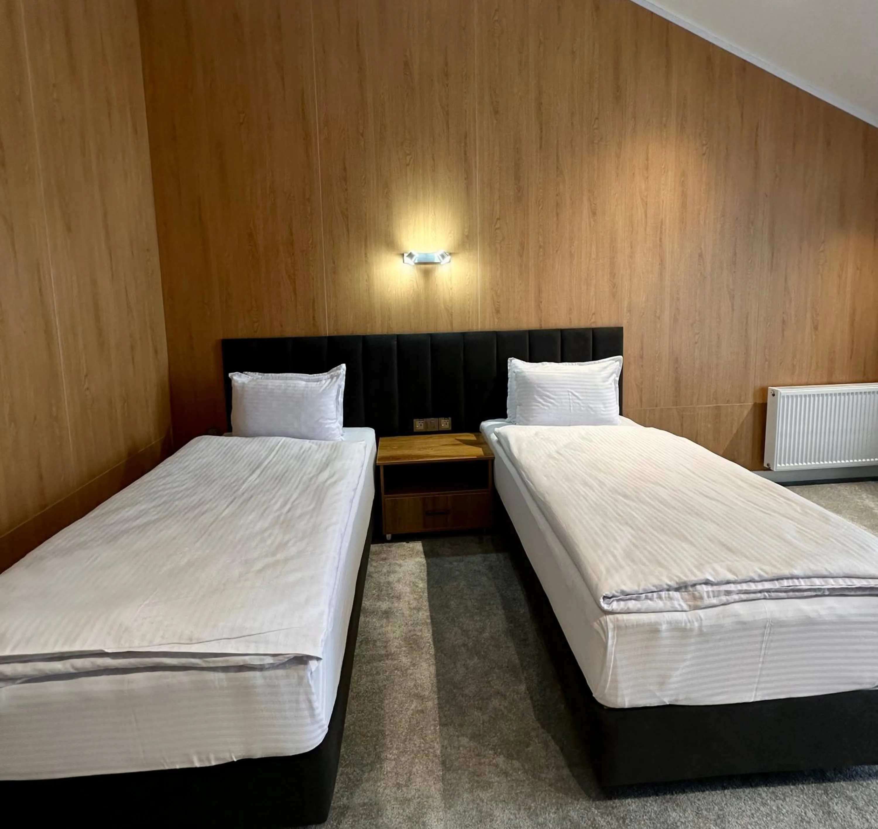 Bed in WELLFORT HOTEL