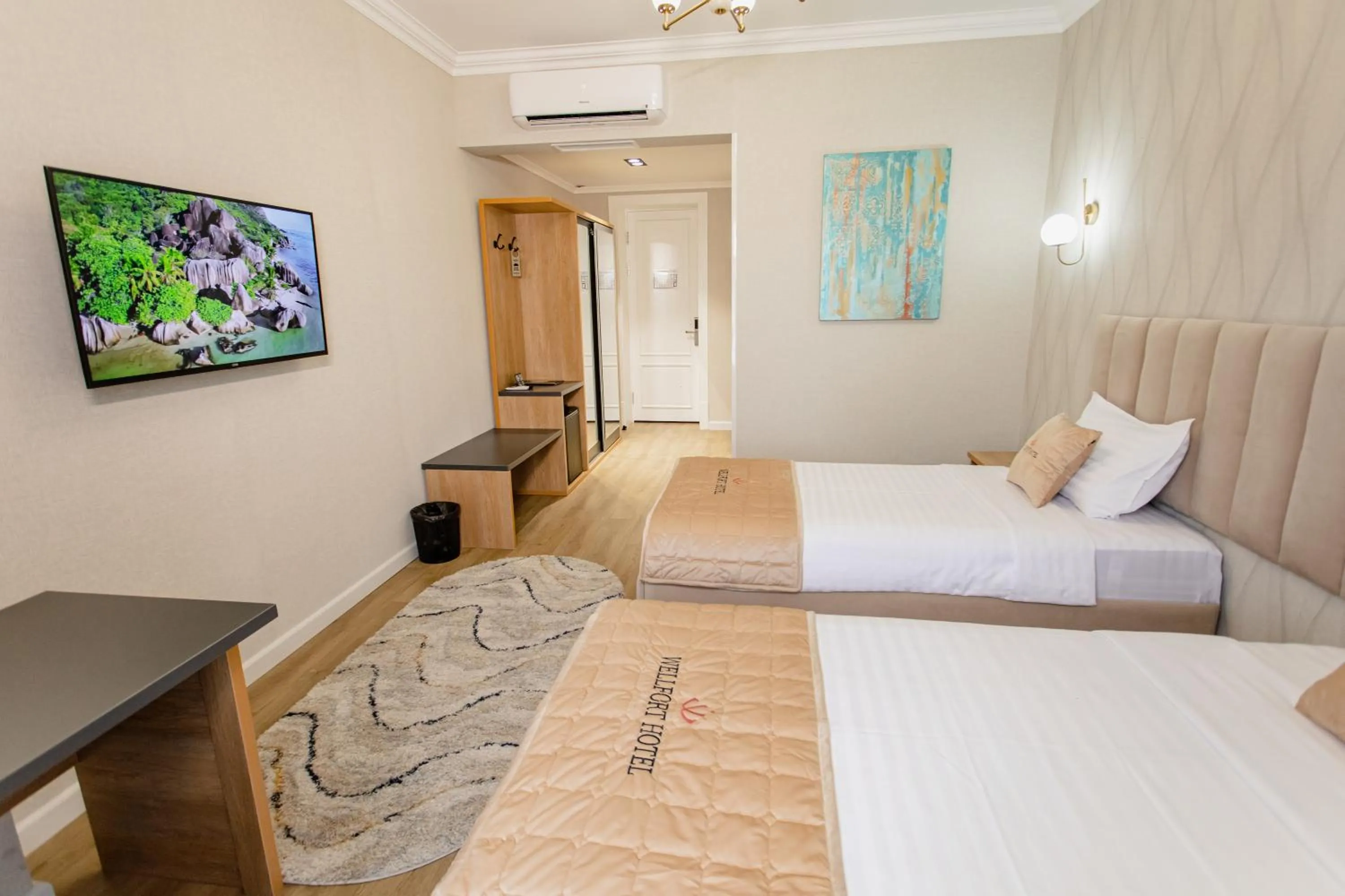 Bed in WELLFORT HOTEL