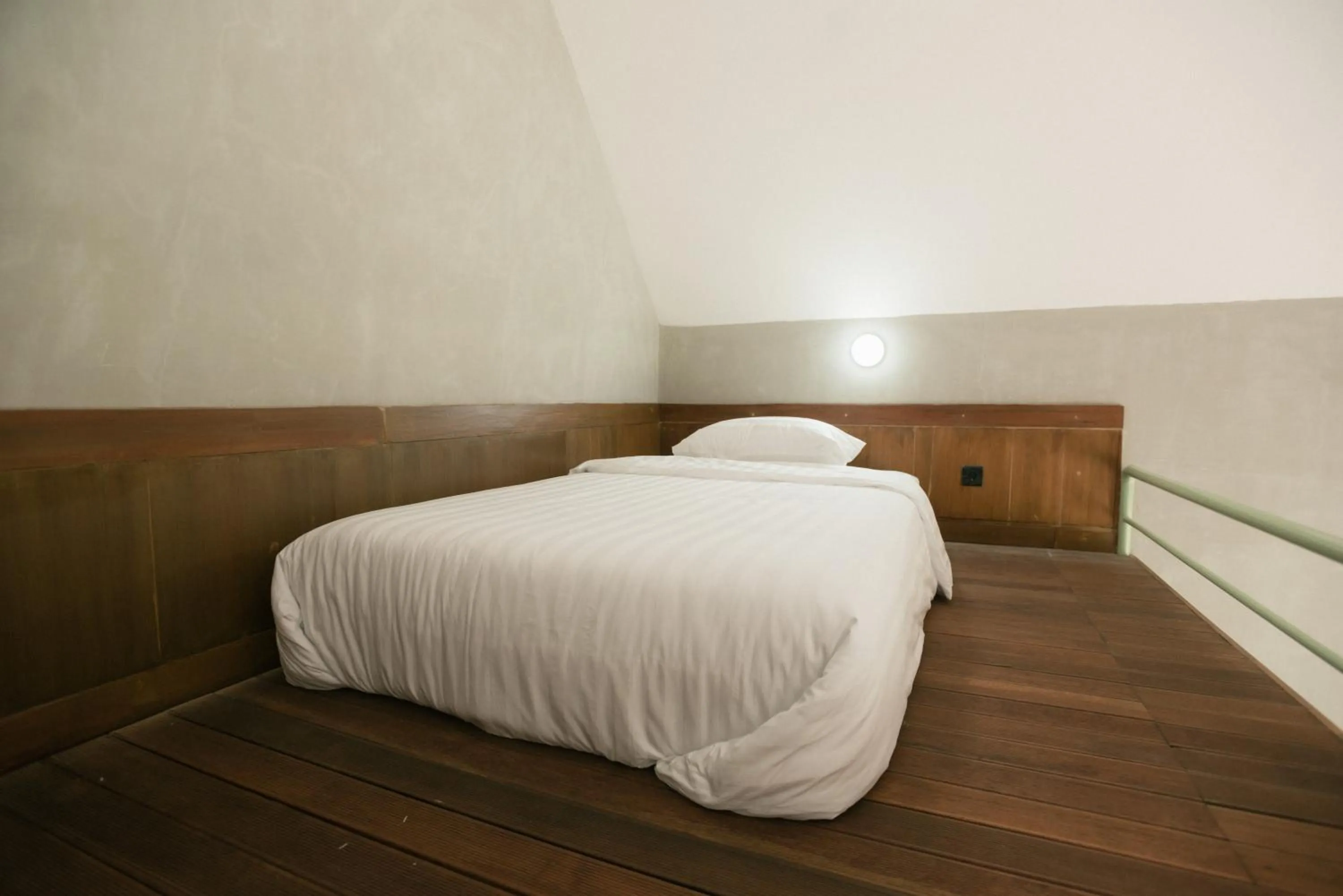 Bed in LAYANA FARMSTAY