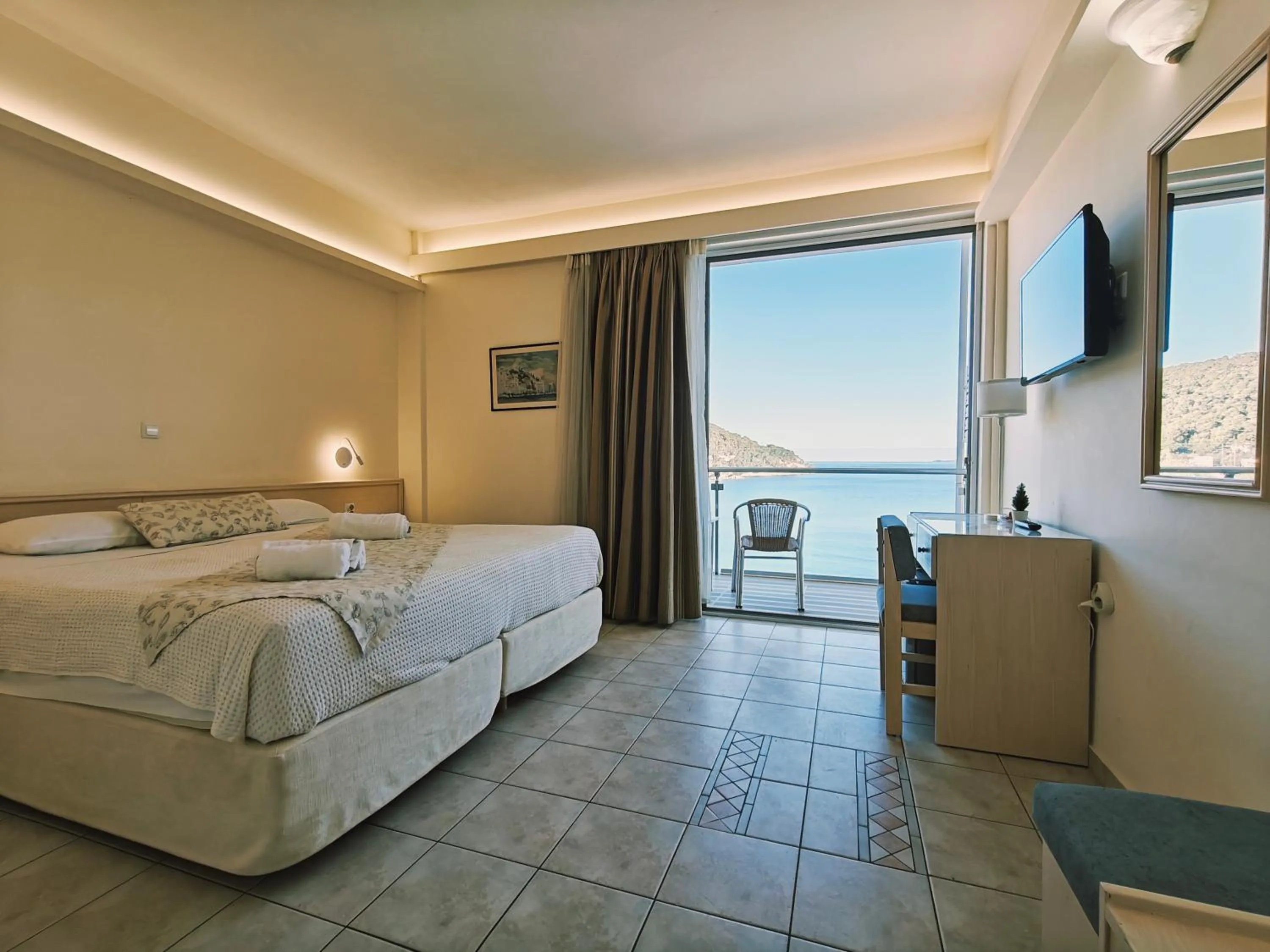 Bed in New Aegli Resort Hotel