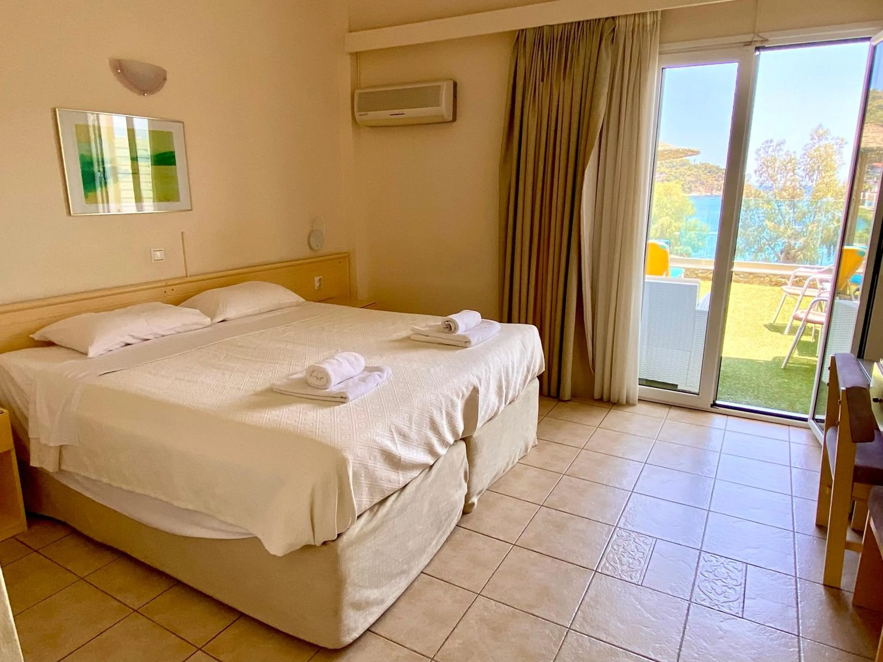 Bed in New Aegli Resort Hotel