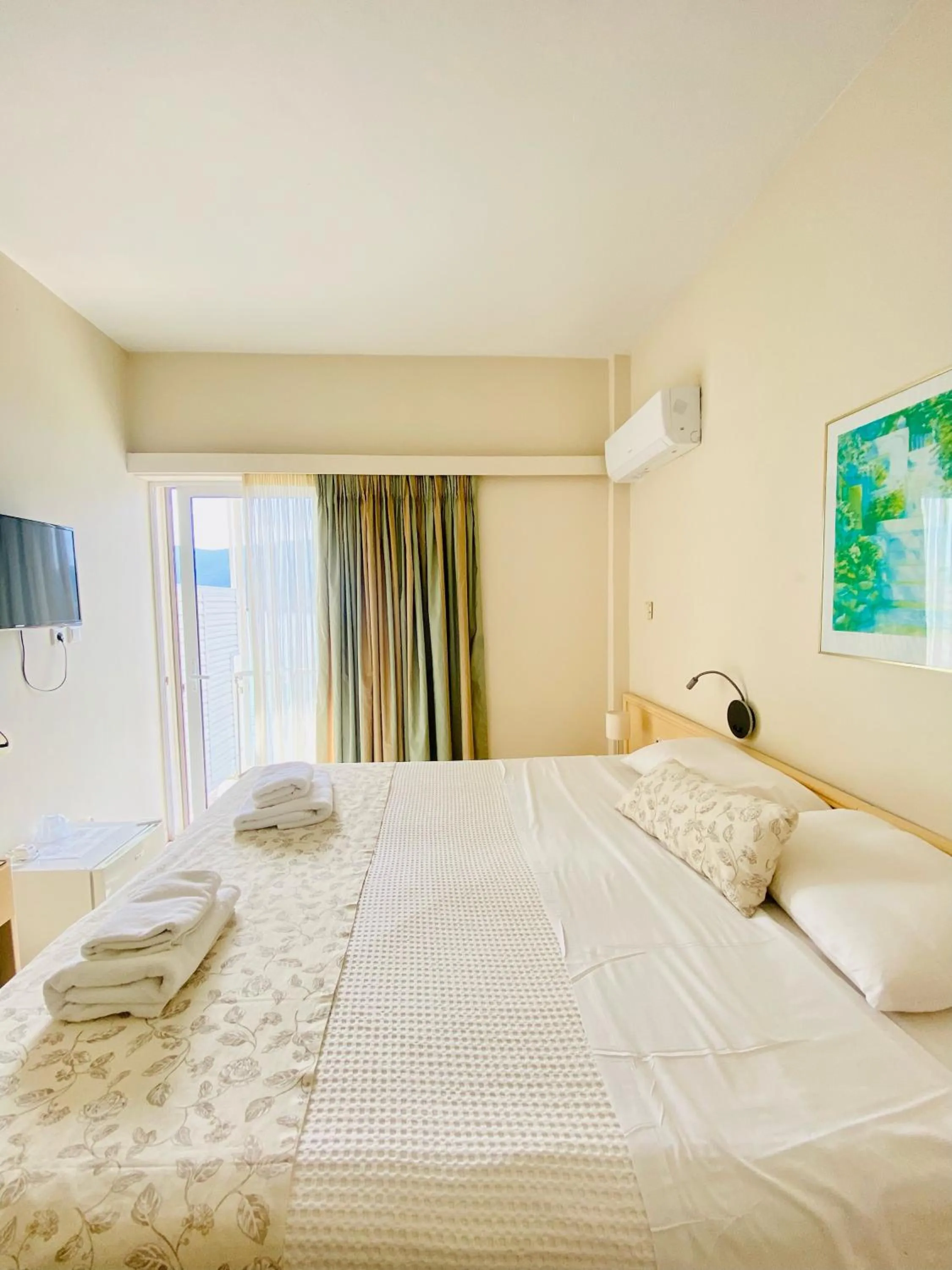 Bed in New Aegli Resort Hotel