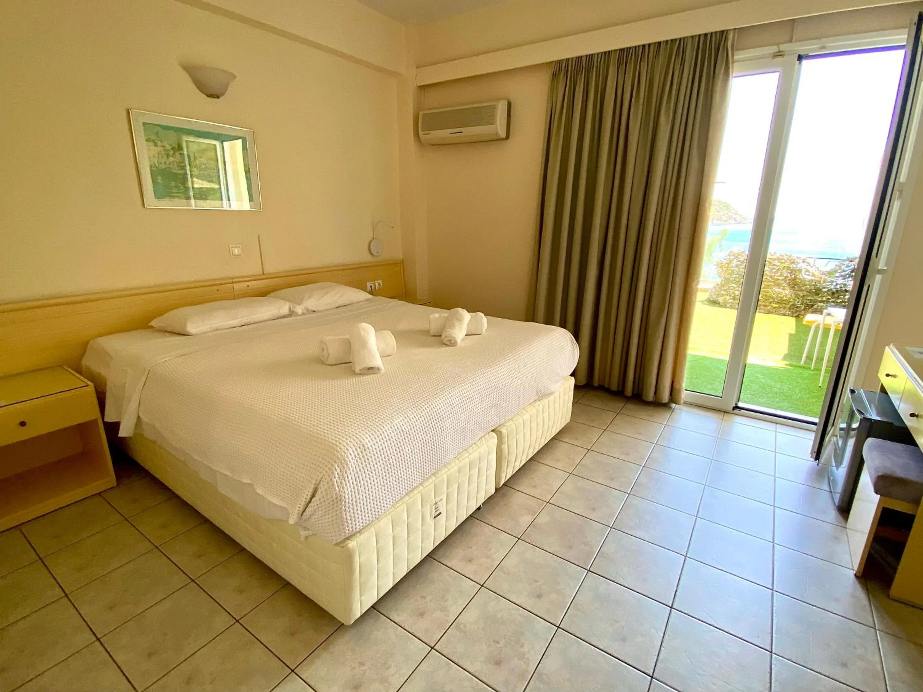 Bed in New Aegli Resort Hotel