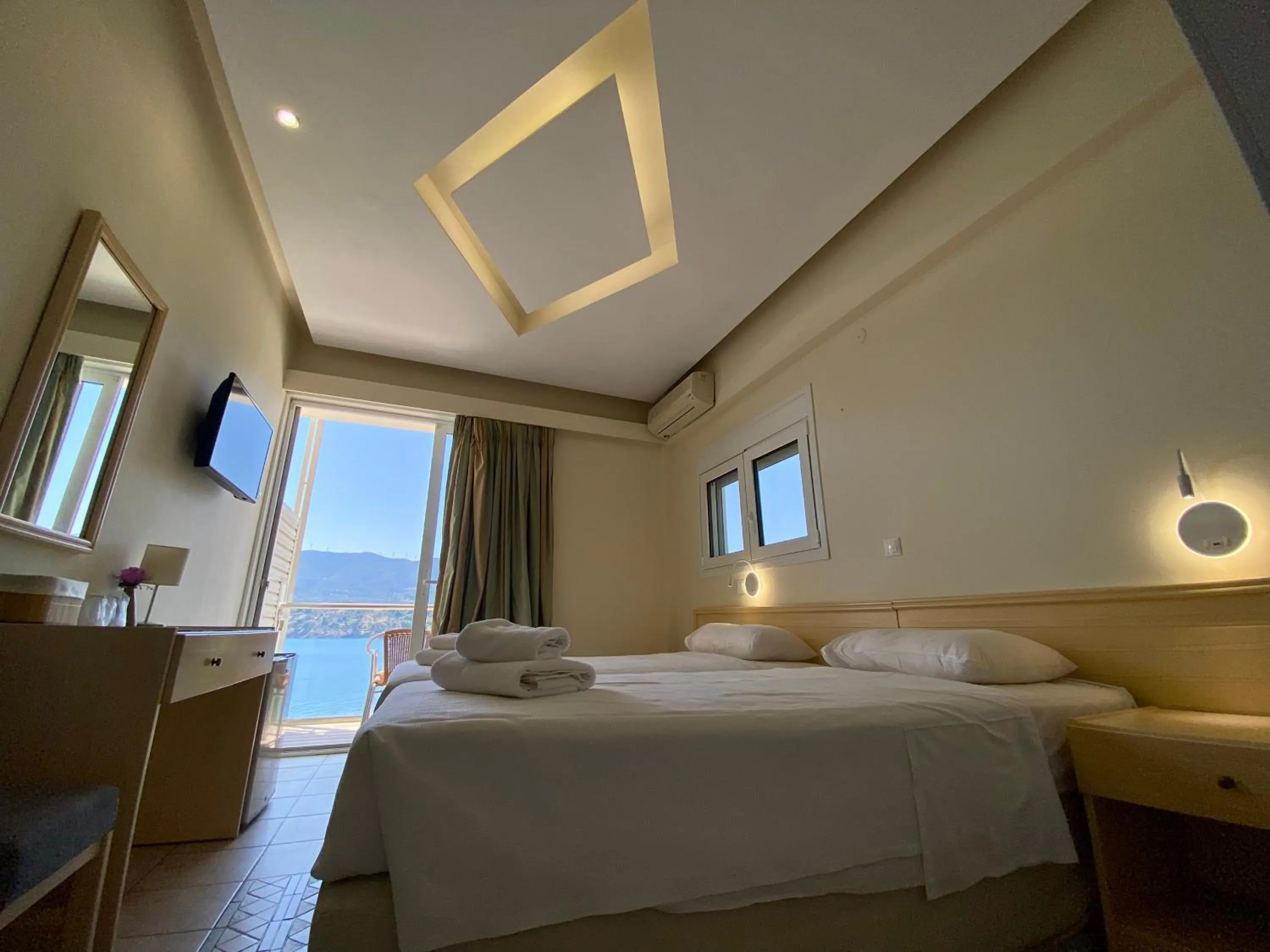 Bed in New Aegli Resort Hotel