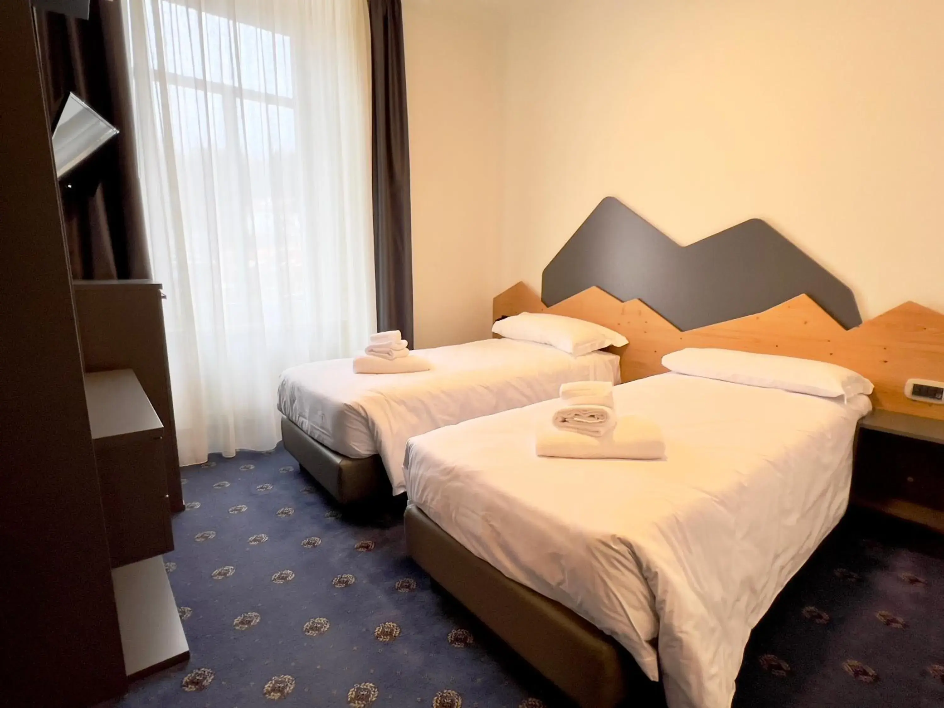 Deluxe Quadruple Room in Hotel Regina del Bosco Deluxe Quadruple Room in Hotel Regina del Bosco