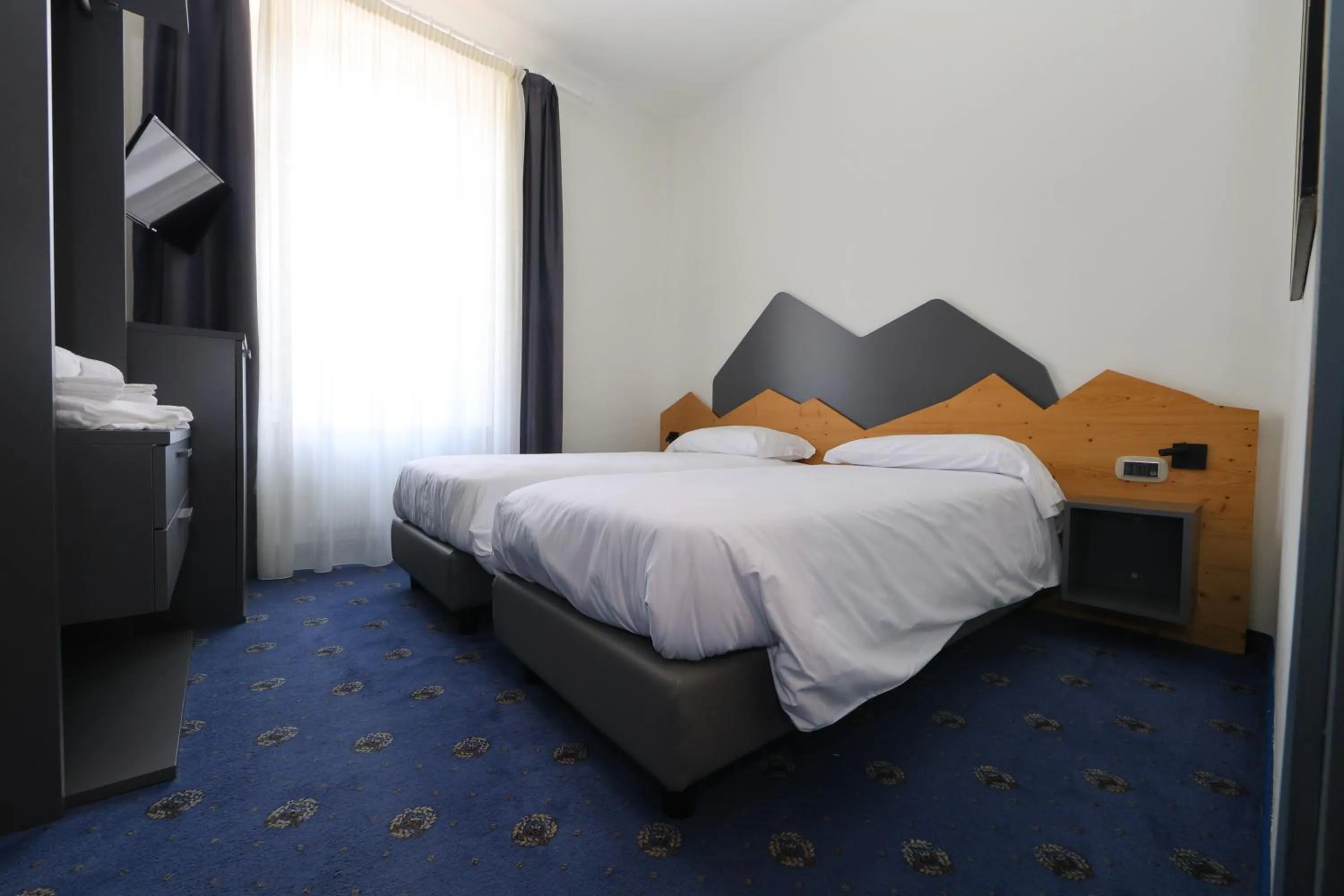 Bed in Hotel Regina del Bosco