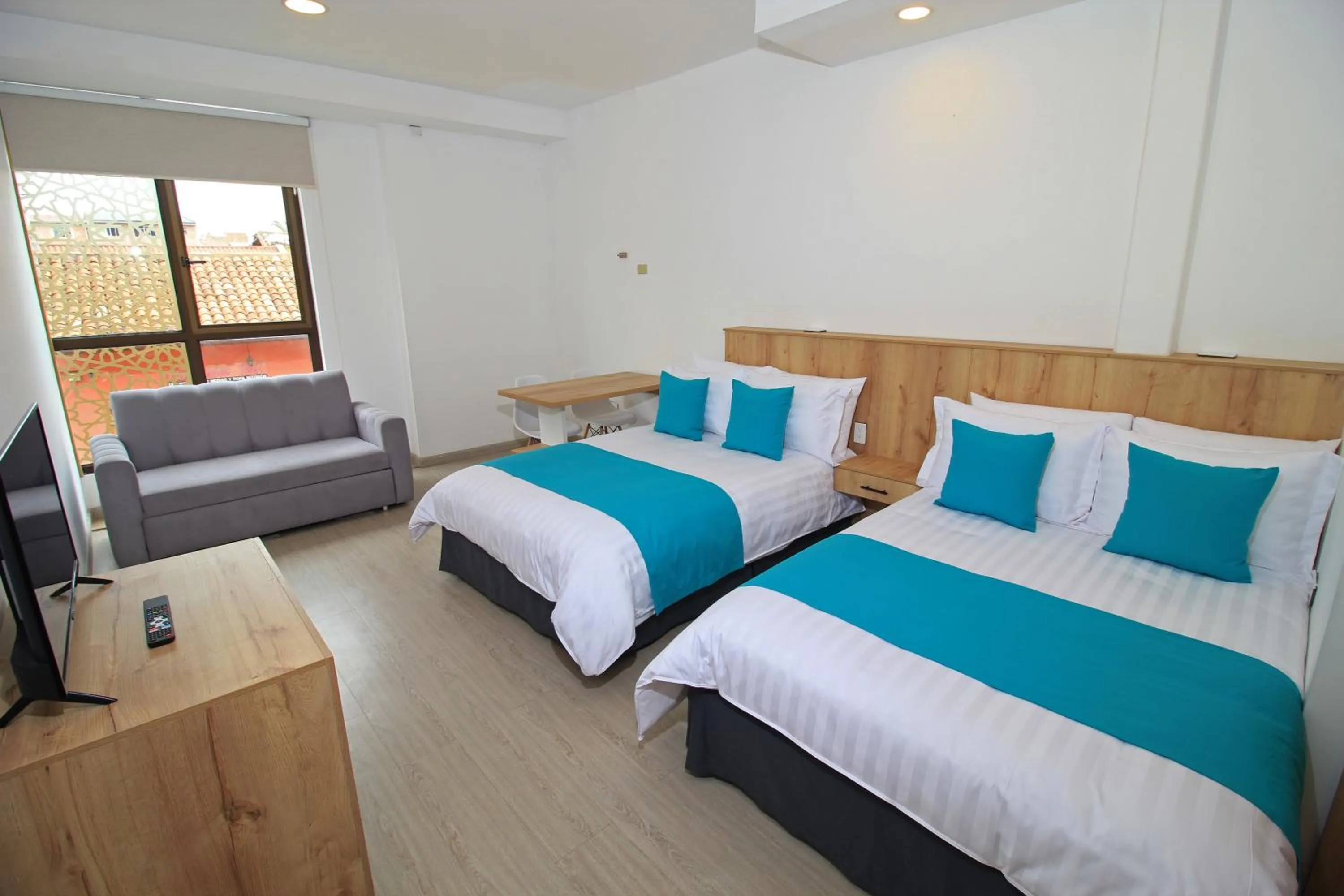 Bed in Apart Hotel Casa Blanca