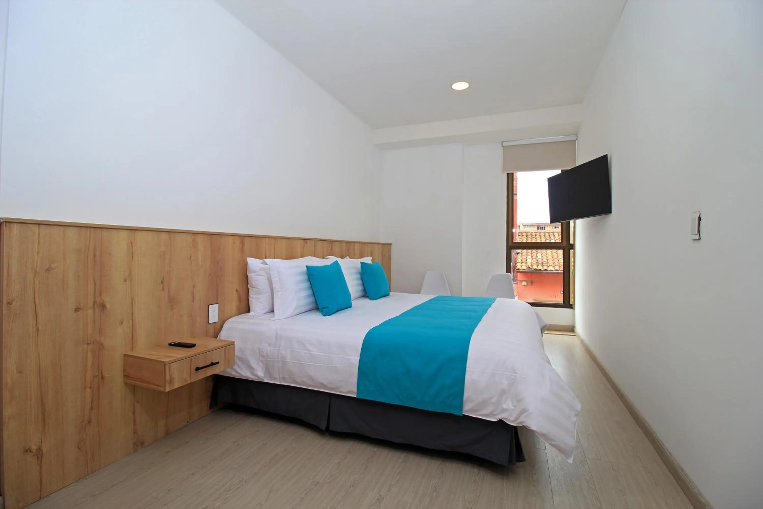 Bed in Apart Hotel Casa Blanca