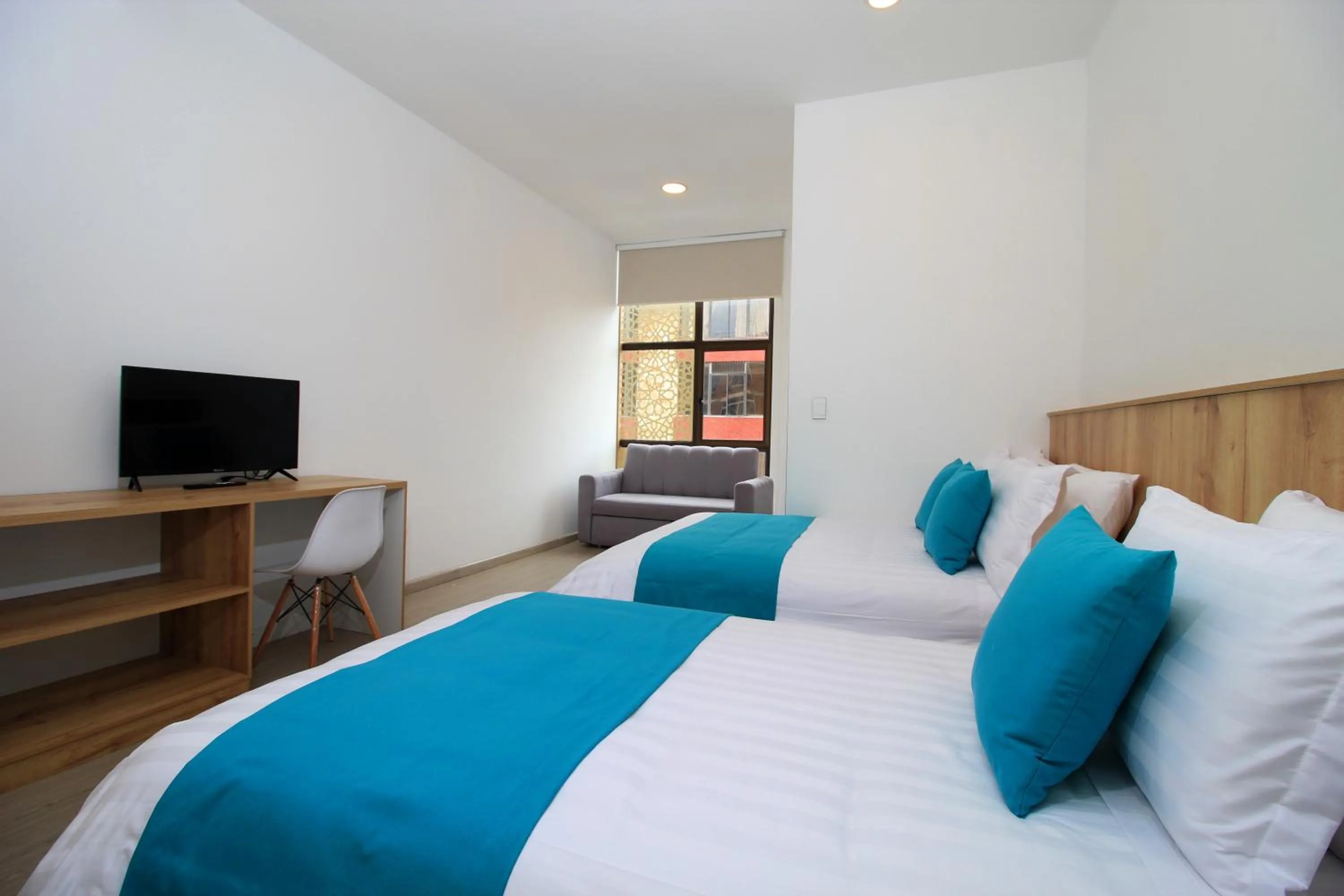 Bed in Apart Hotel Casa Blanca