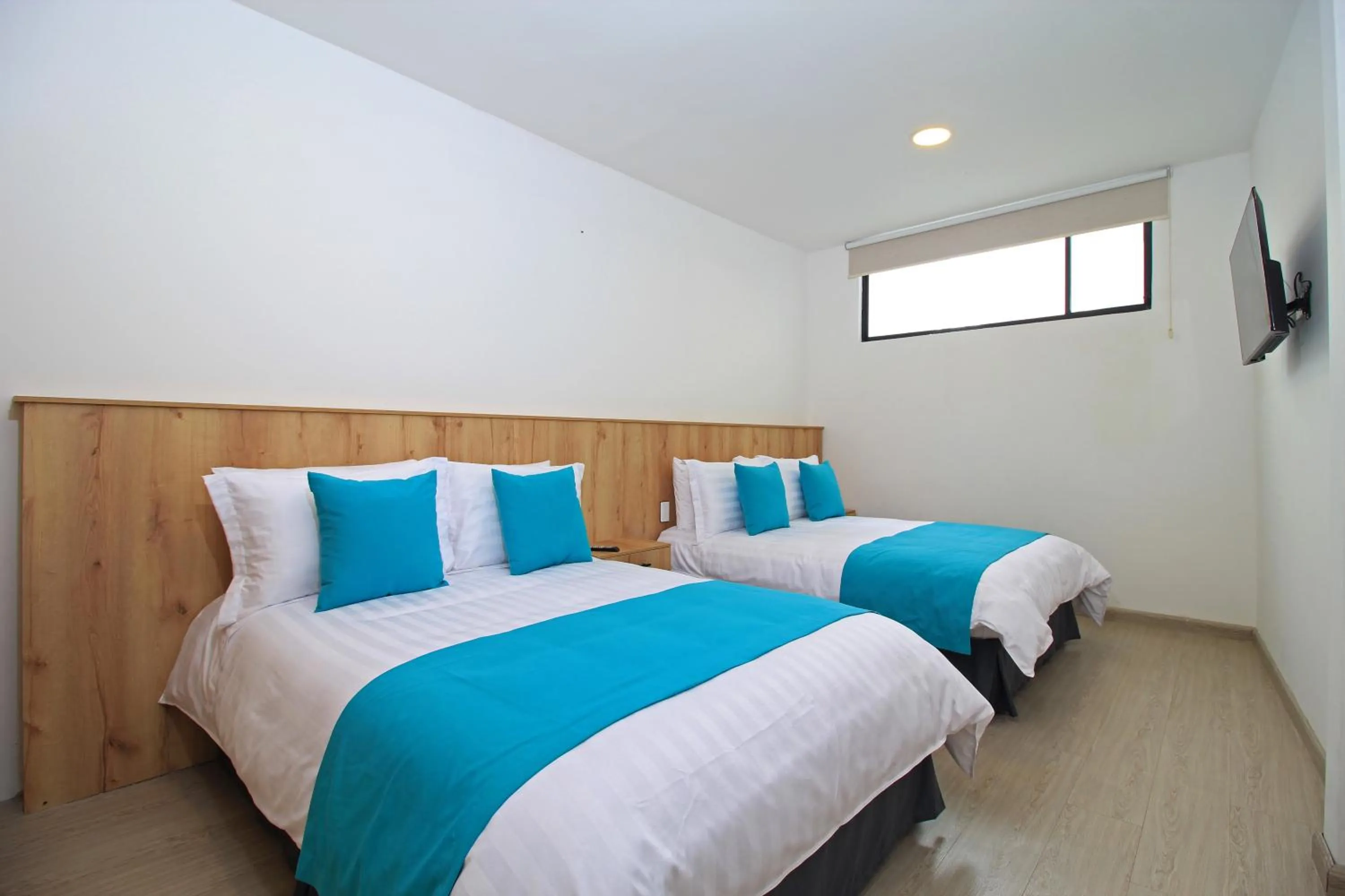 Bed in Apart Hotel Casa Blanca