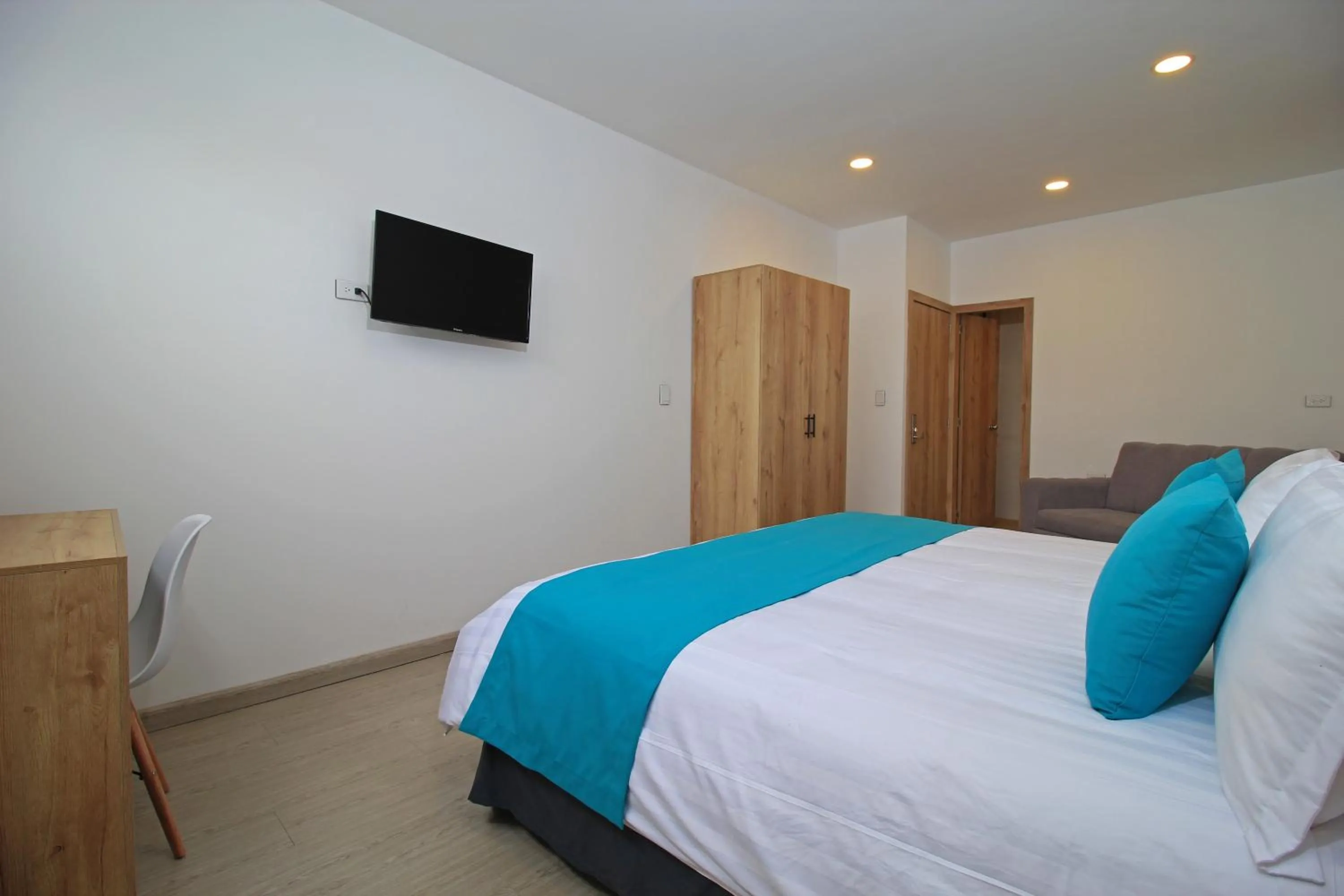 Bed in Apart Hotel Casa Blanca