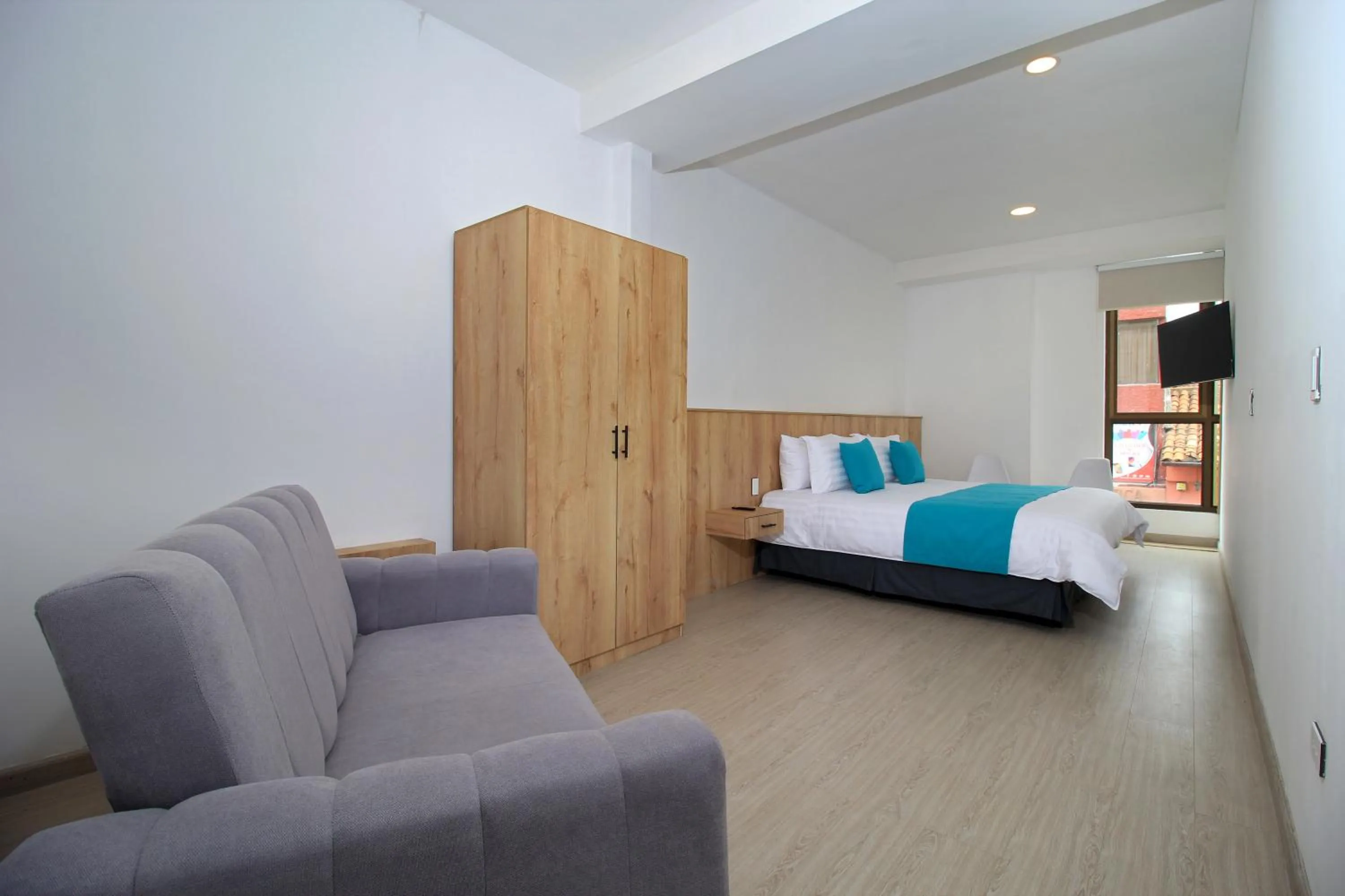 Bed in Apart Hotel Casa Blanca