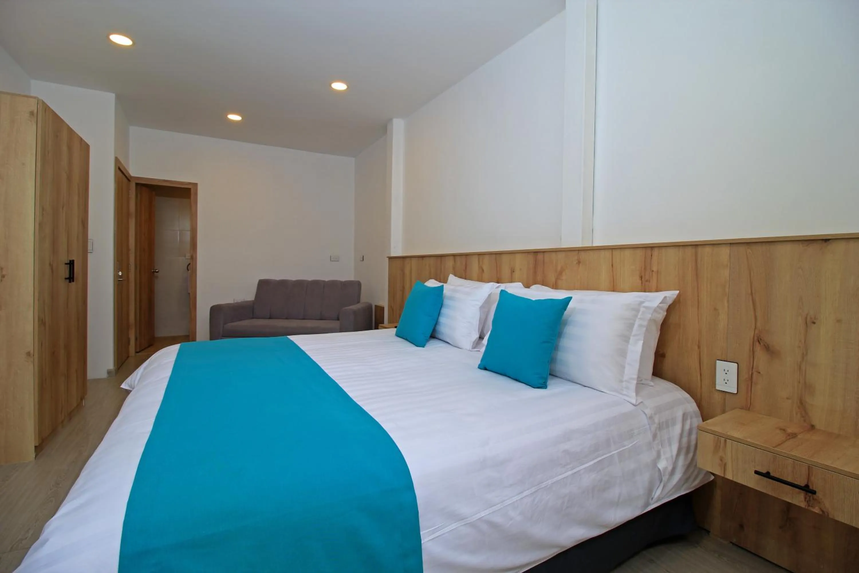 Bed in Apart Hotel Casa Blanca