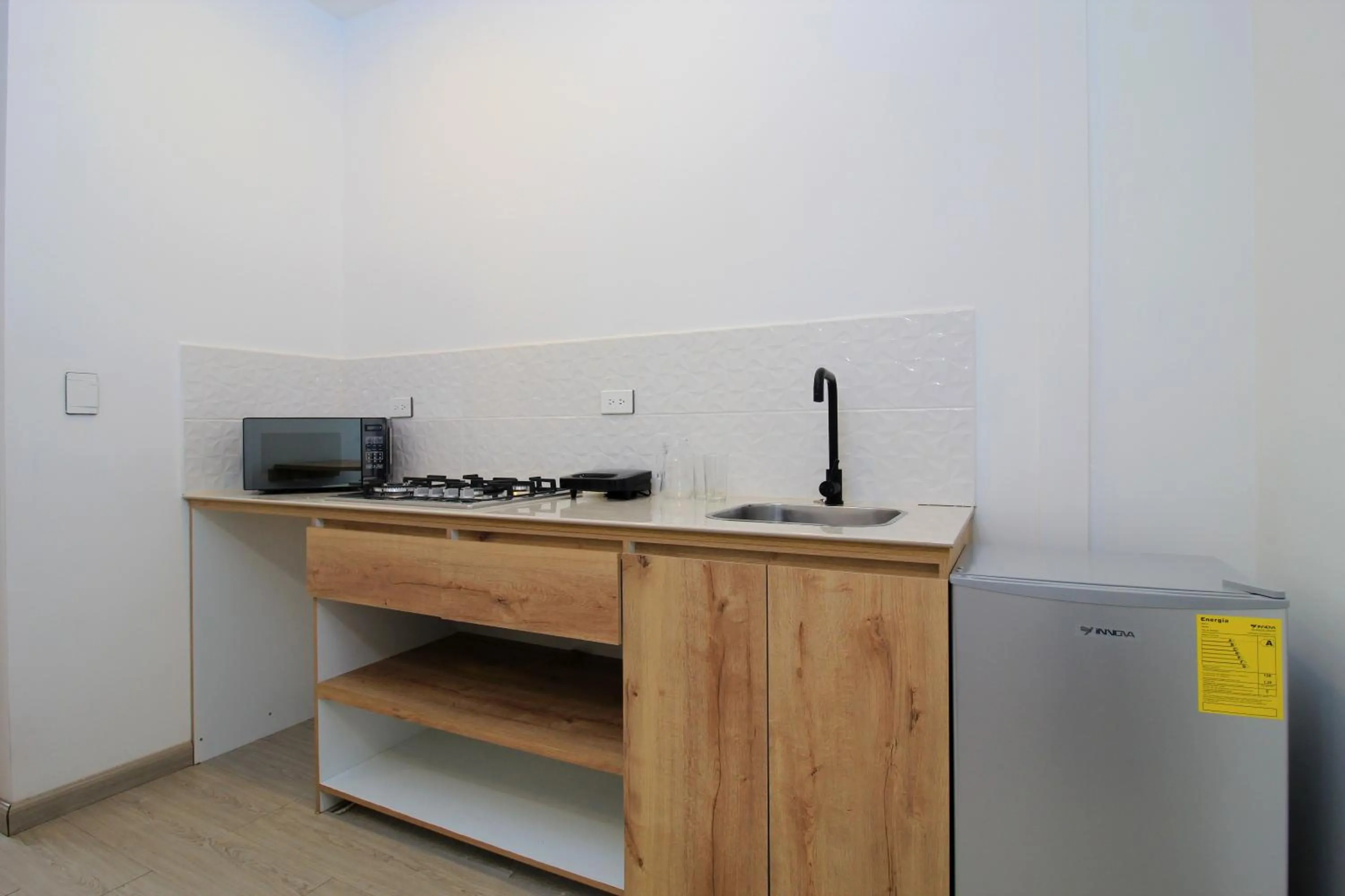 Kitchen or kitchenette in Apart Hotel Casa Blanca