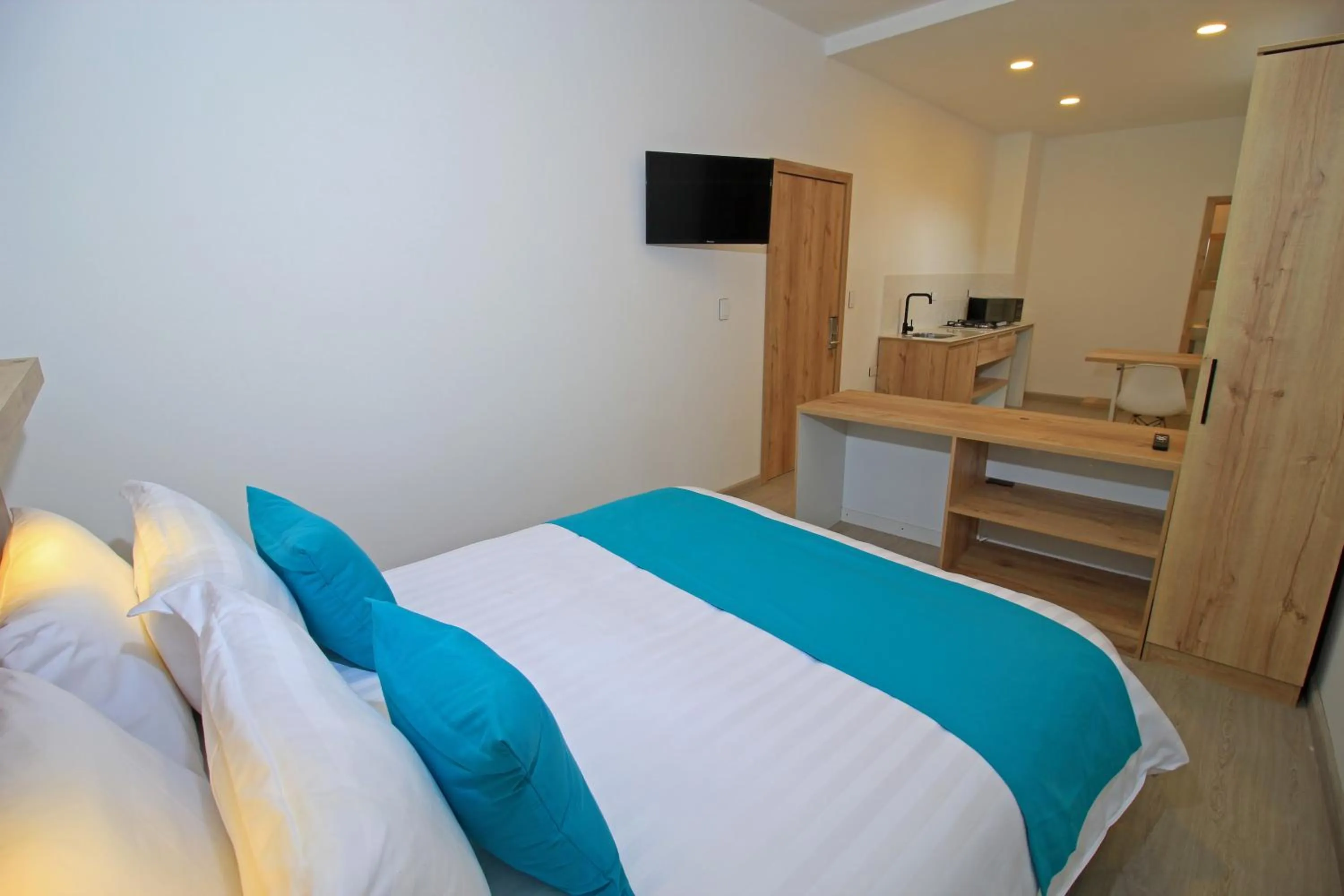 Bed in Apart Hotel Casa Blanca