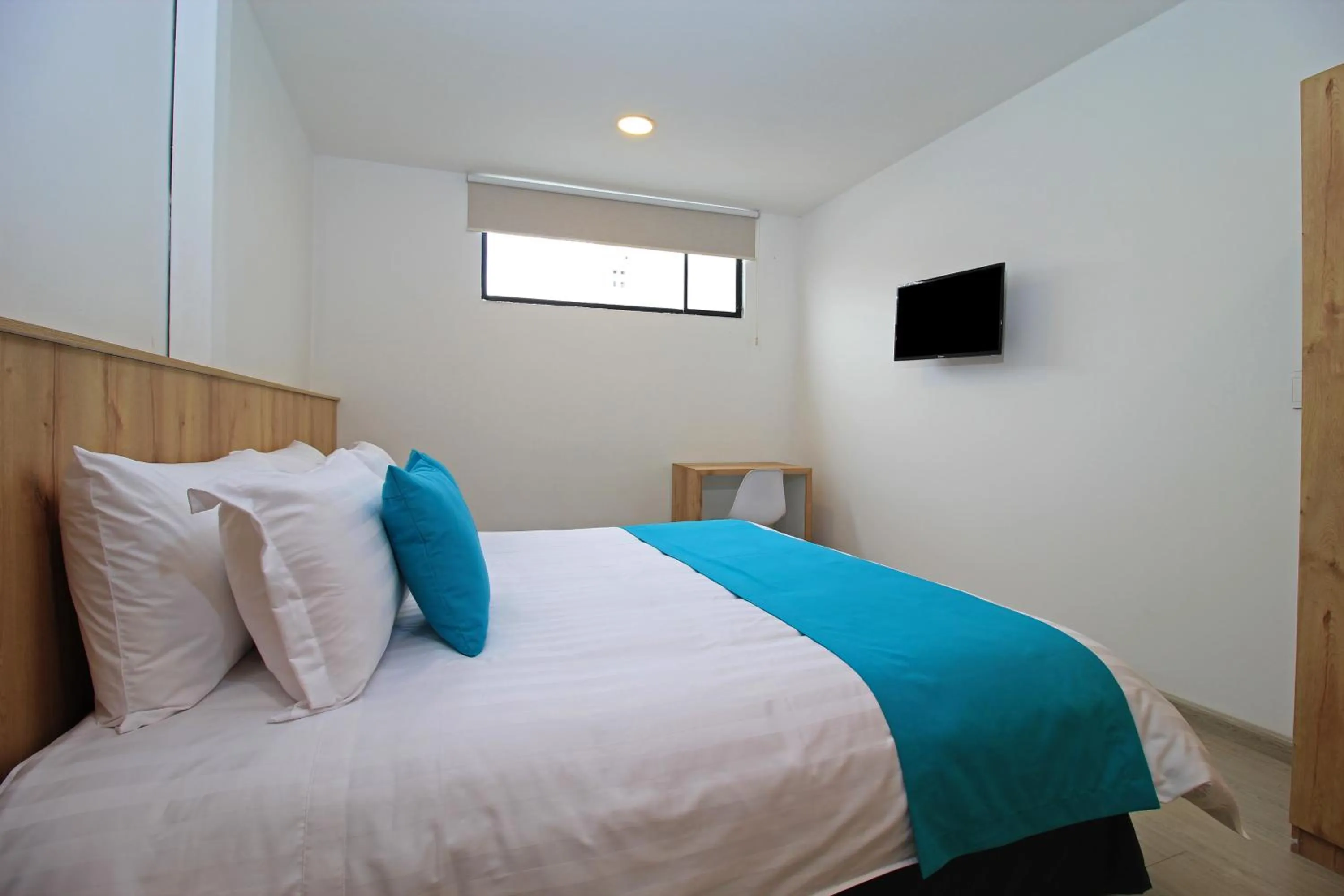 Bed in Apart Hotel Casa Blanca