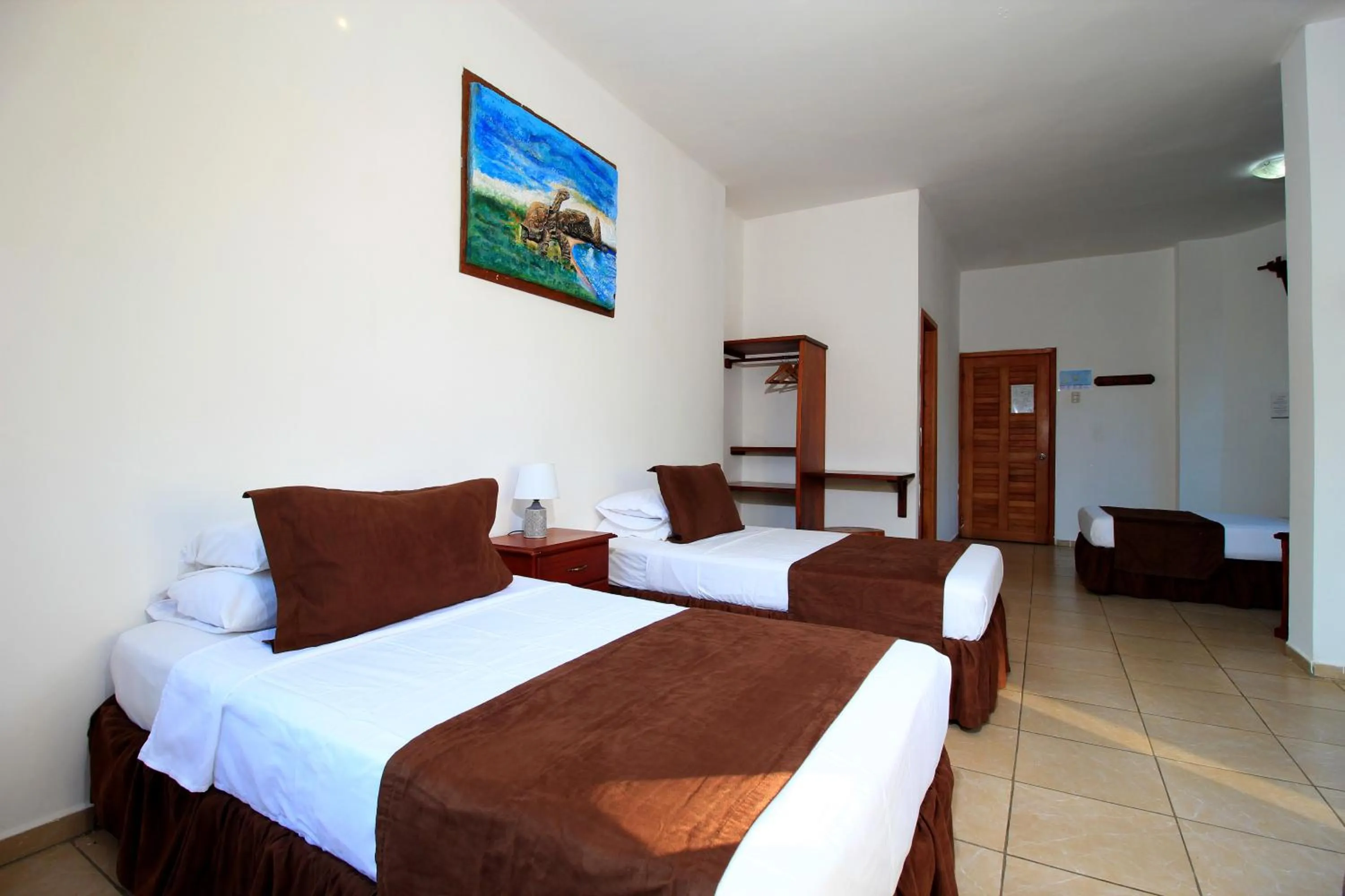 Photo of the whole room, Bed in Natura Gardens Galápagos