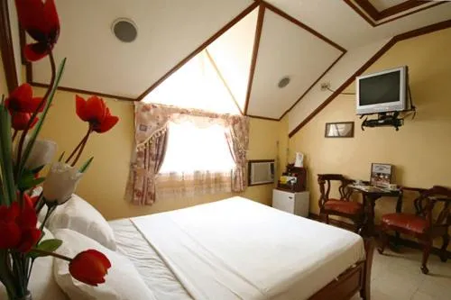 Bed in PALM TREE RESORT AND RESTAURANT