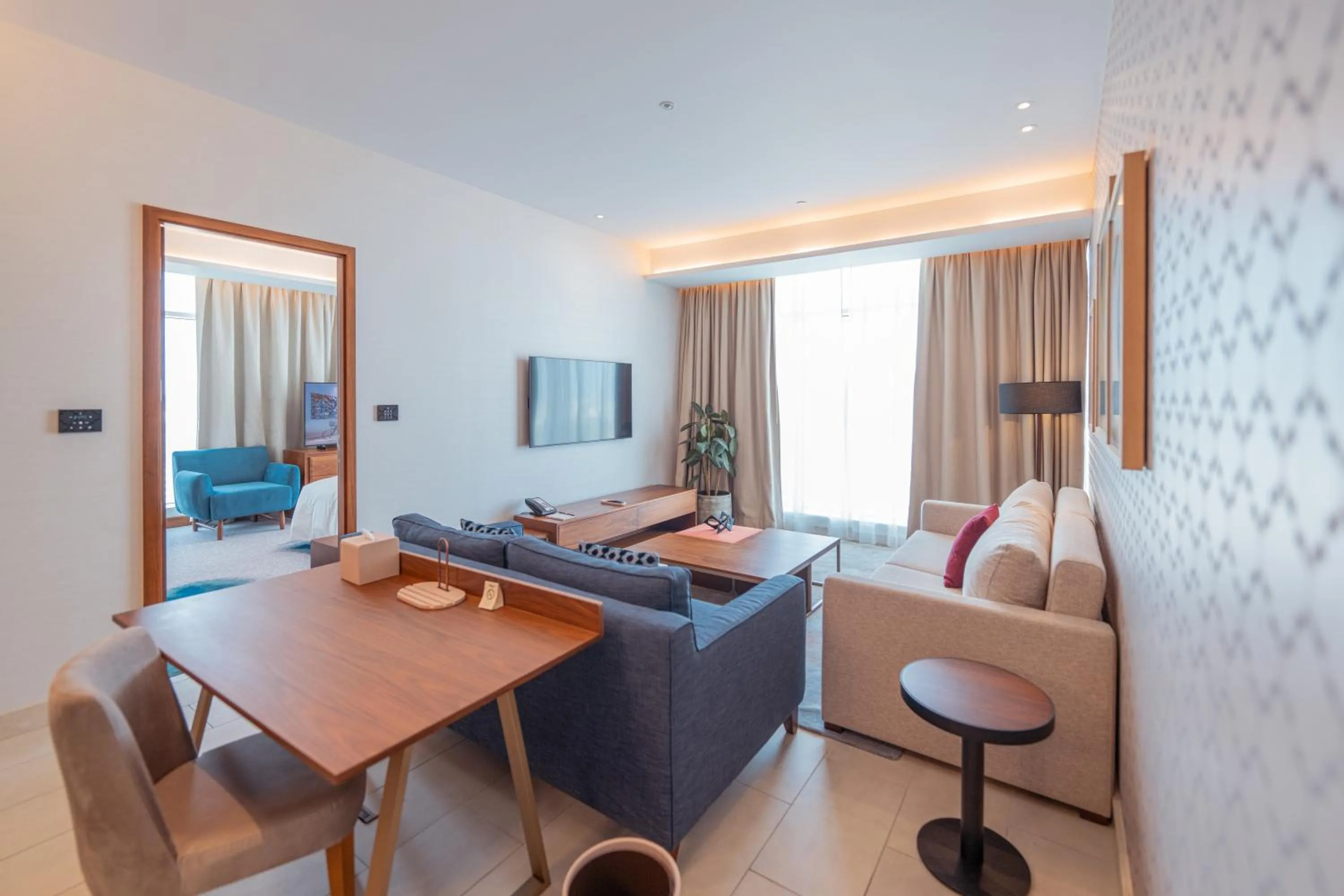Living room in Abesq Doha Hotel and Residences, an IHG Hotel