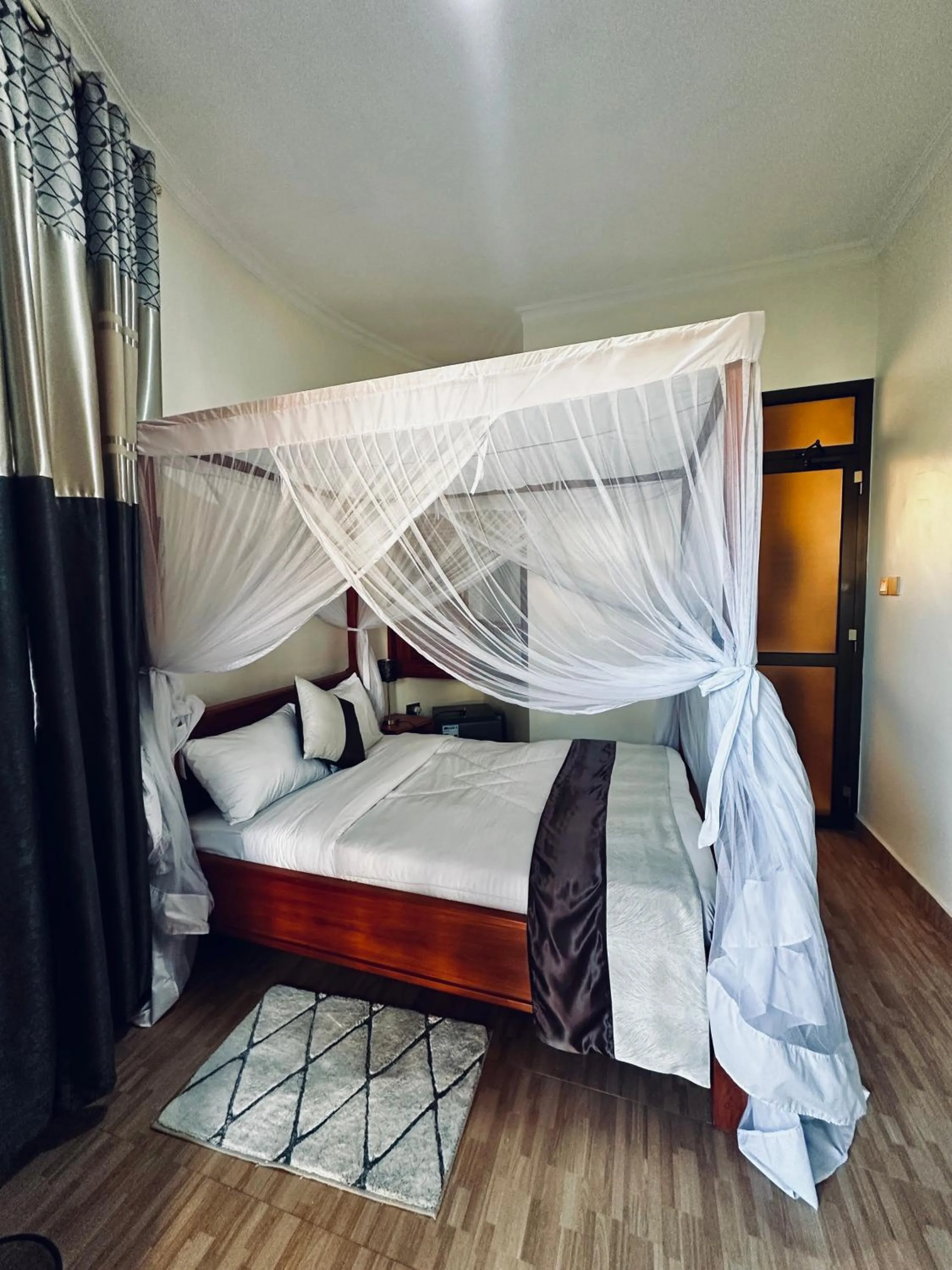 Bedroom, Bed in Wademac Arusha Inn Hotel