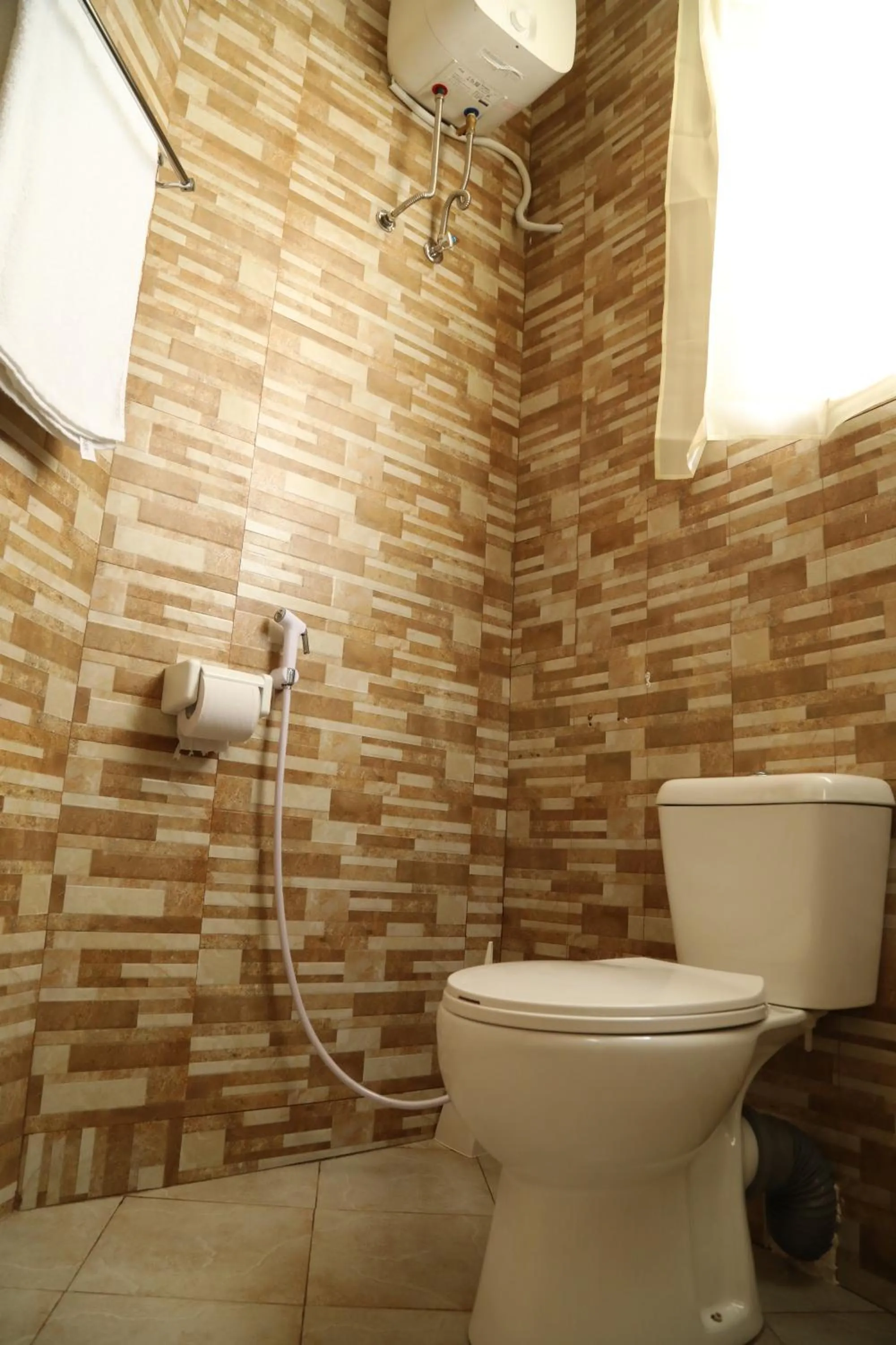 Toilet in Wademac Arusha Inn Hotel