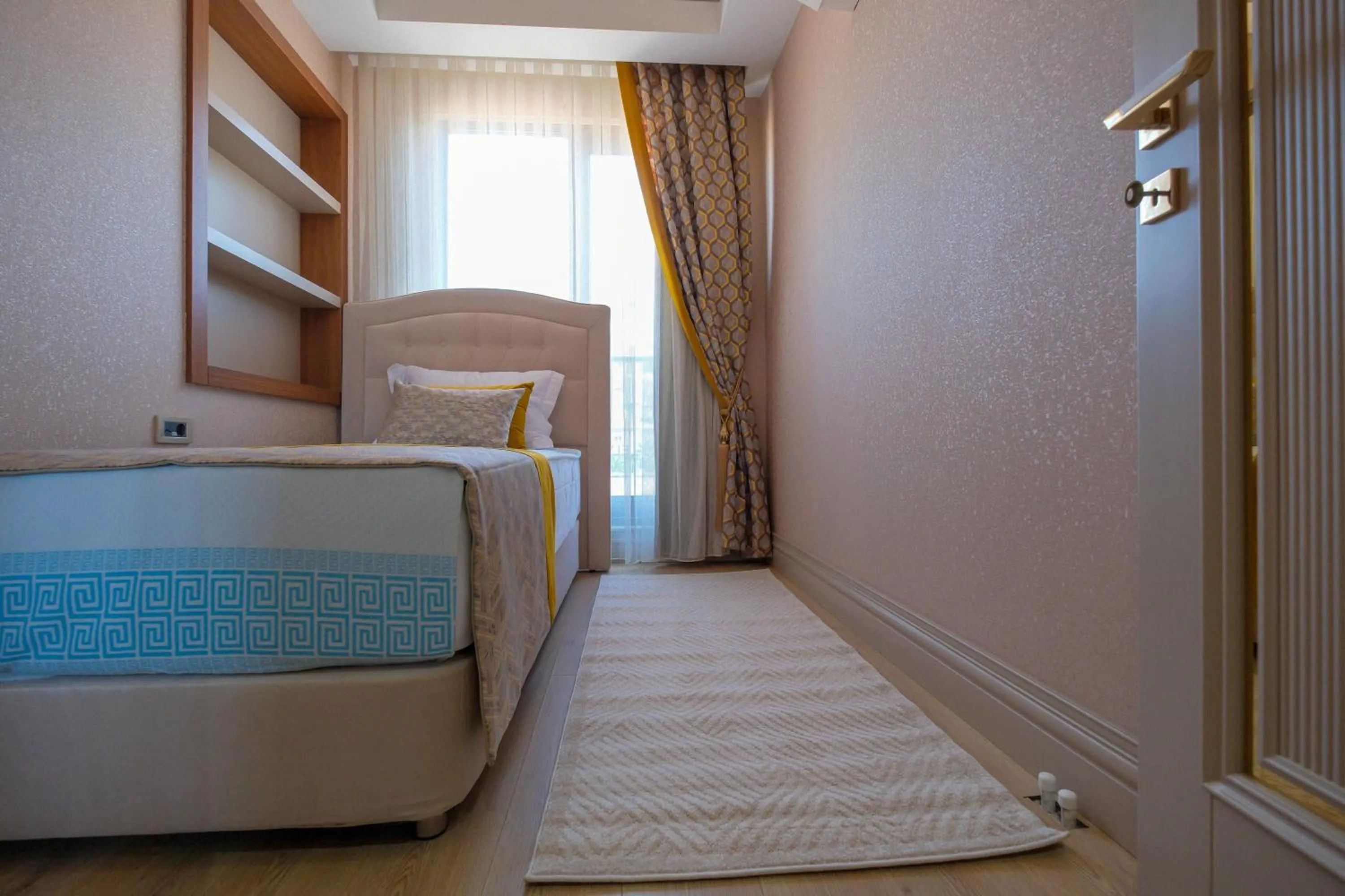 Bed in Elysium Deluxe Suites Antalya