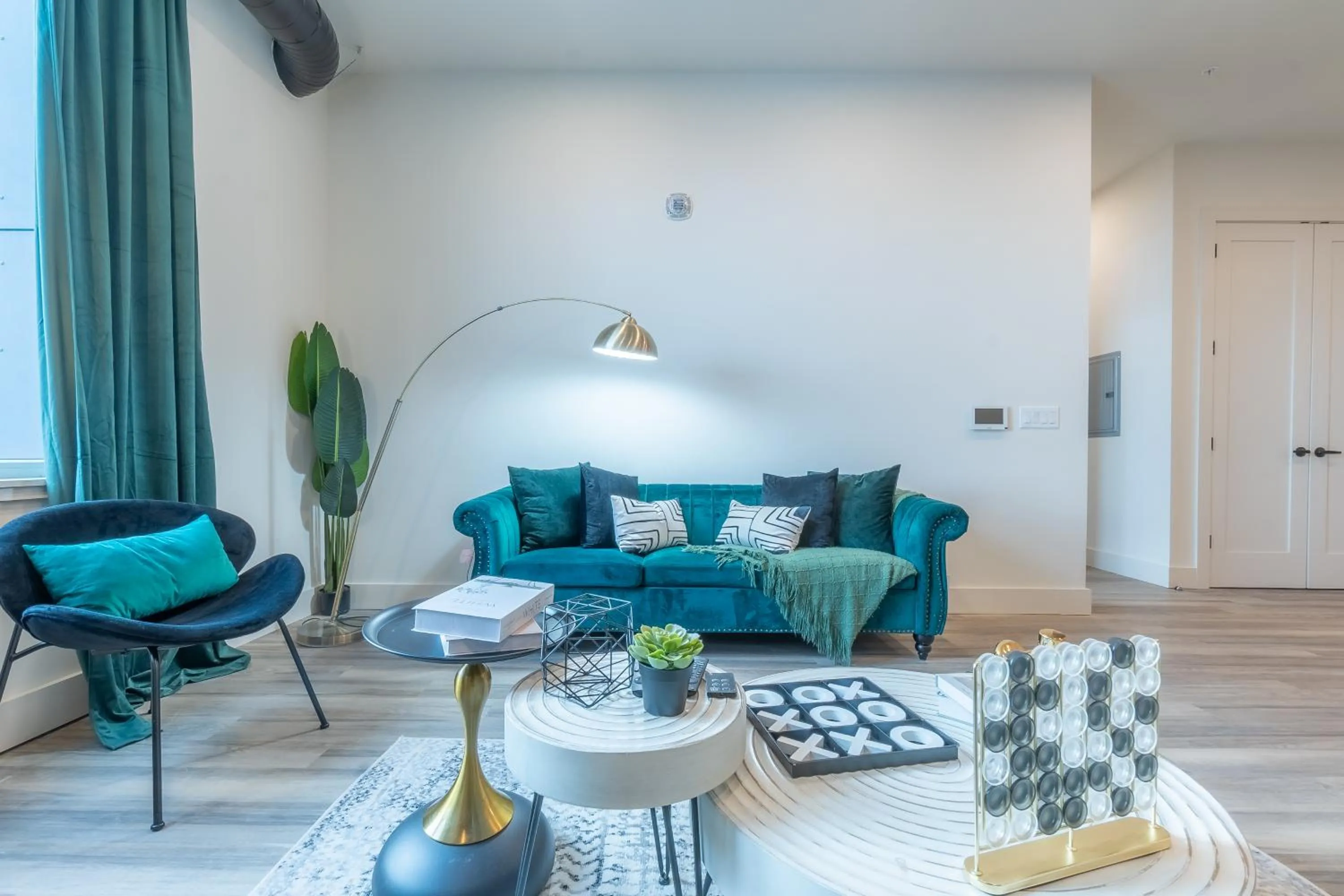 Living room in Emerald Escape, Free Parking, 2 Bath, Sleeps 8 Near American Dream and The Airport, King Bed and 2 Queen Beds, Washer and Dryer