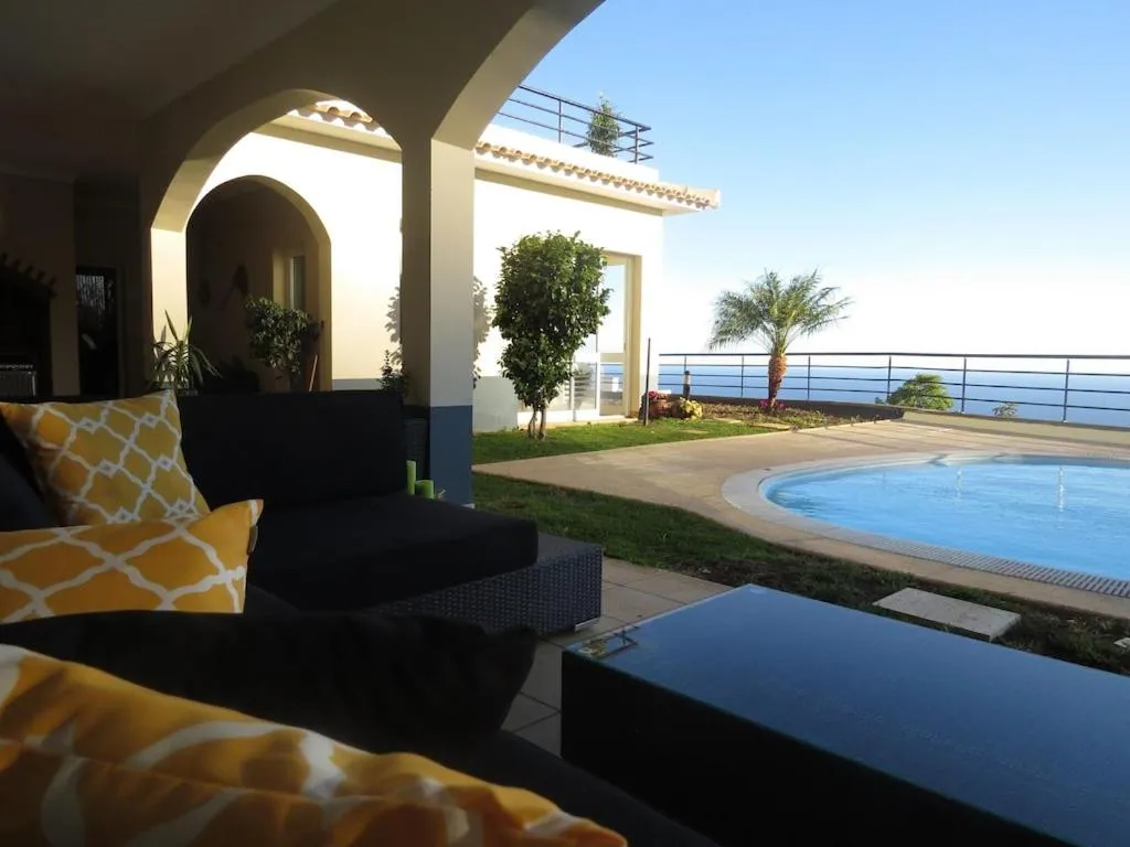Swimming pool in Luxury villa with private heated pool, garden and views of the sea and mountains.