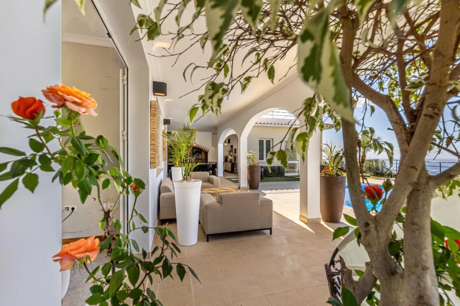 Patio in Luxury villa with private heated pool, garden and views of the sea and mountains.