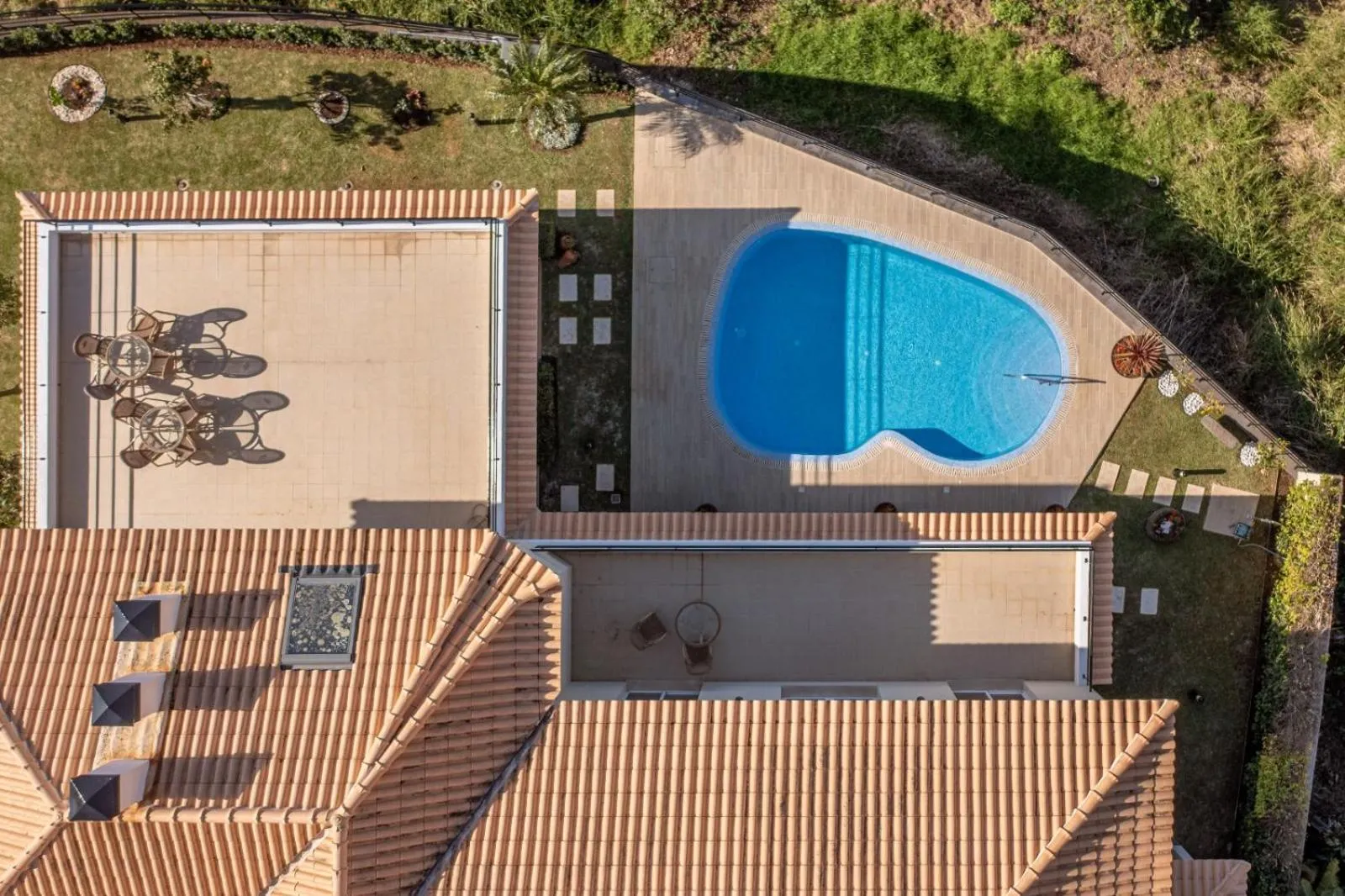 Patio in Luxury villa with private heated pool, garden and views of the sea and mountains.