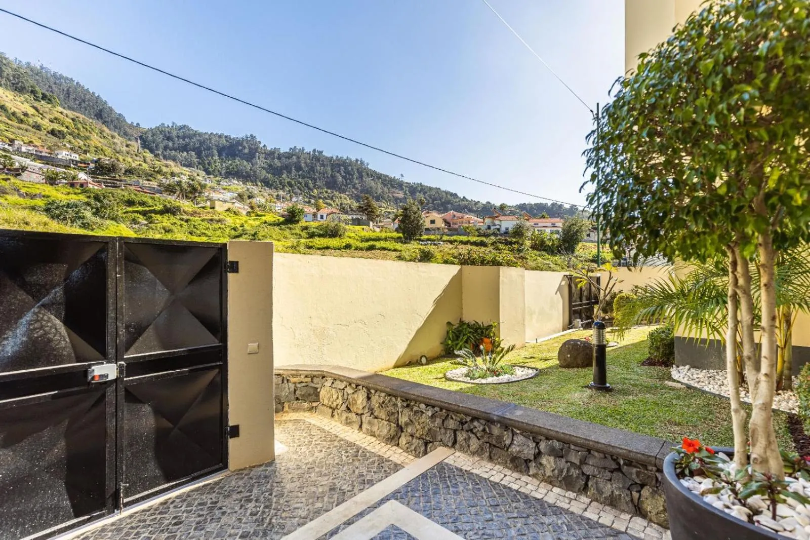 Luxury villa with private heated pool, garden and views of the sea and mountains.