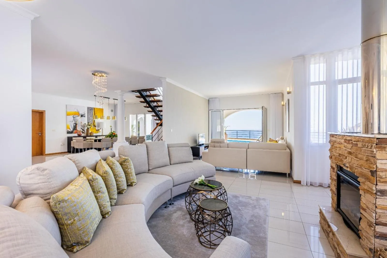 Living room in Luxury villa with private heated pool, garden and views of the sea and mountains.