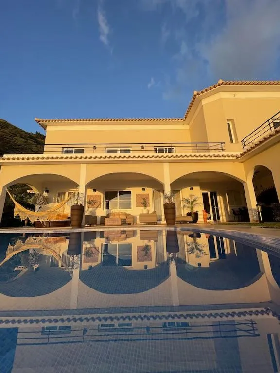 Balcony/Terrace in Luxury villa with private heated pool, garden and views of the sea and mountains.