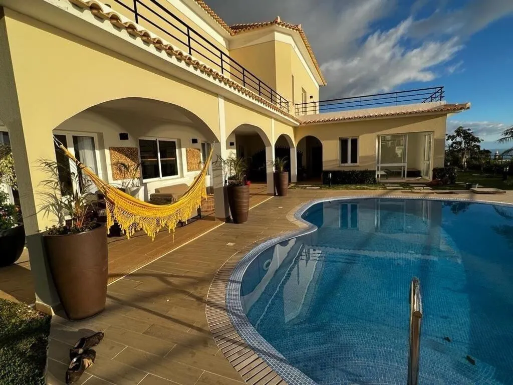 Balcony/Terrace in Luxury villa with private heated pool, garden and views of the sea and mountains.