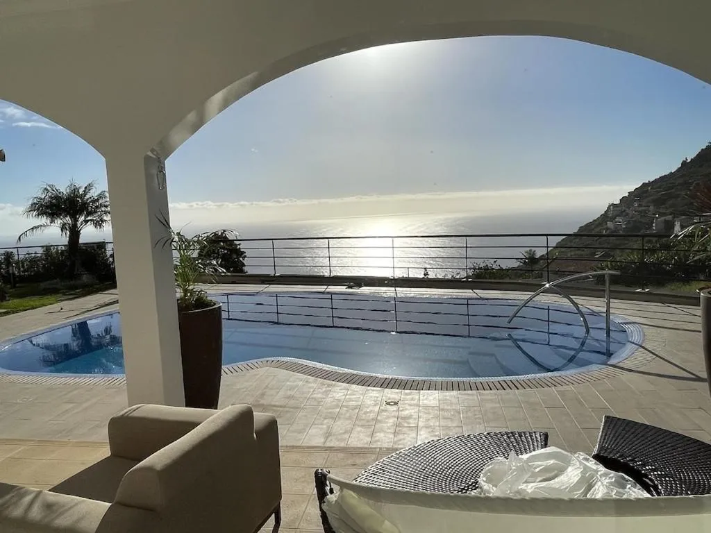 Swimming pool in Luxury villa with private heated pool, garden and views of the sea and mountains.