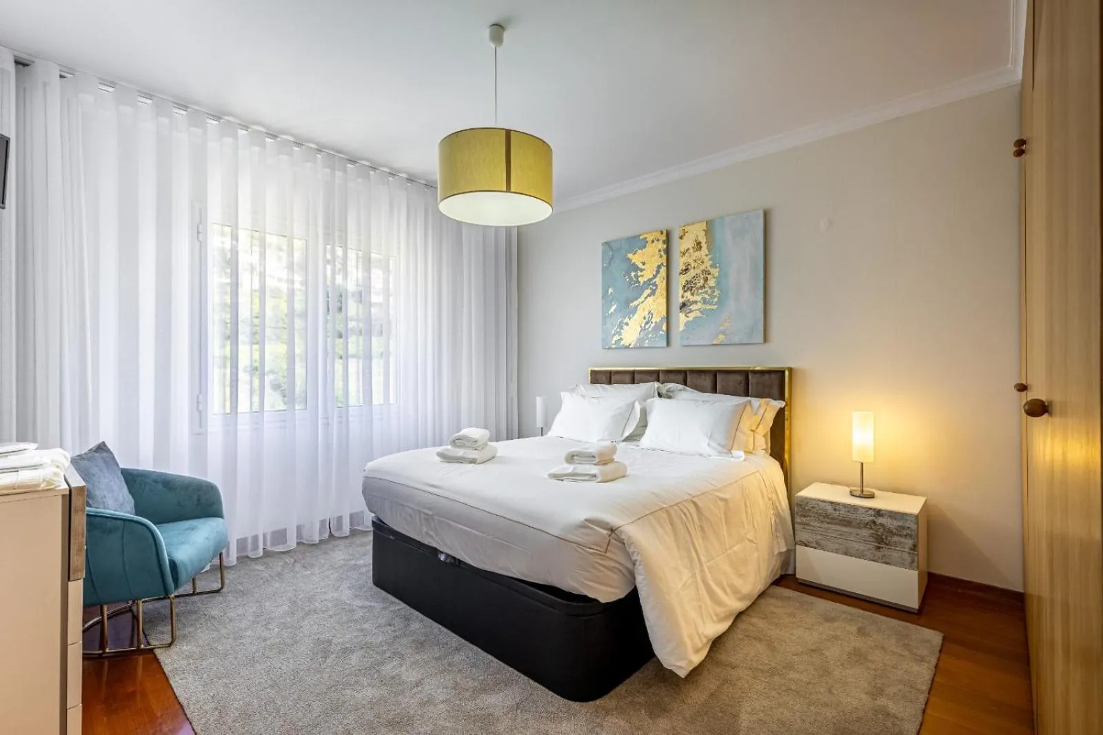 Bed in Luxury villa with private heated pool, garden and views of the sea and mountains.