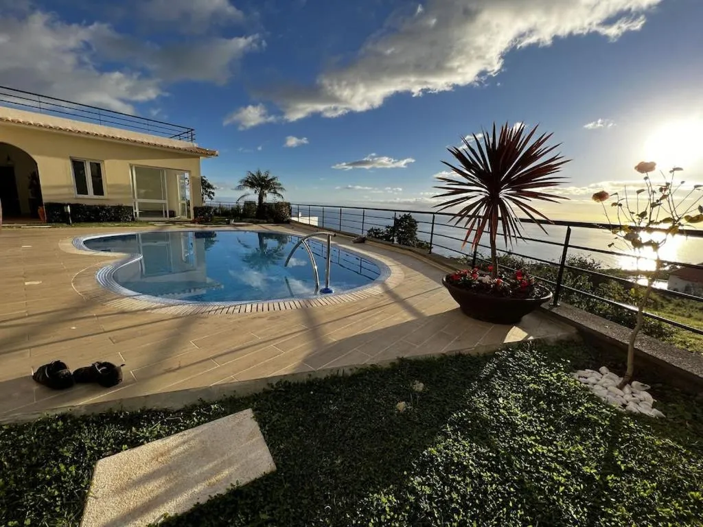 Swimming pool in Luxury villa with private heated pool, garden and views of the sea and mountains.