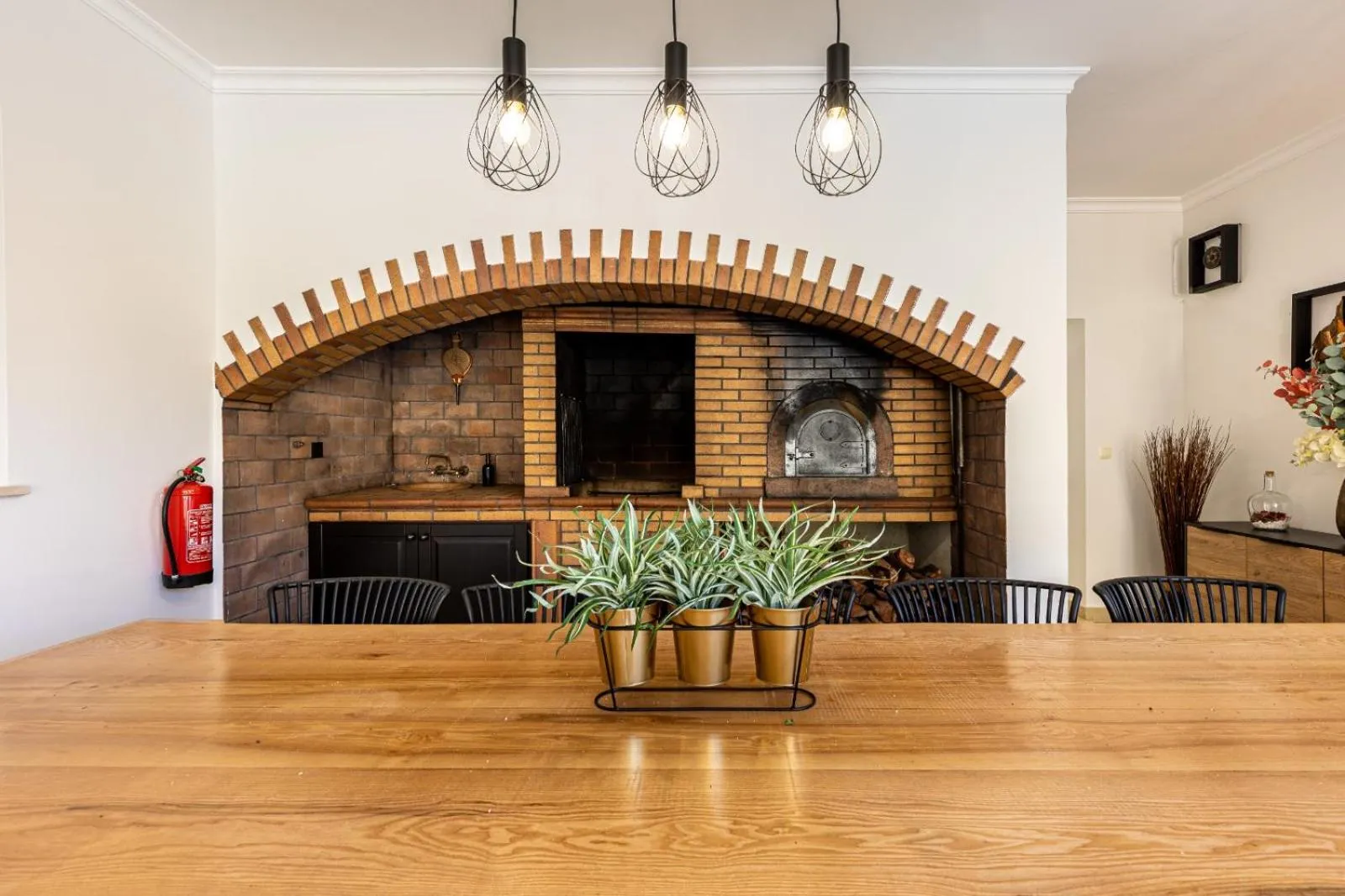 Dining area in Luxury villa with private heated pool, garden and views of the sea and mountains.