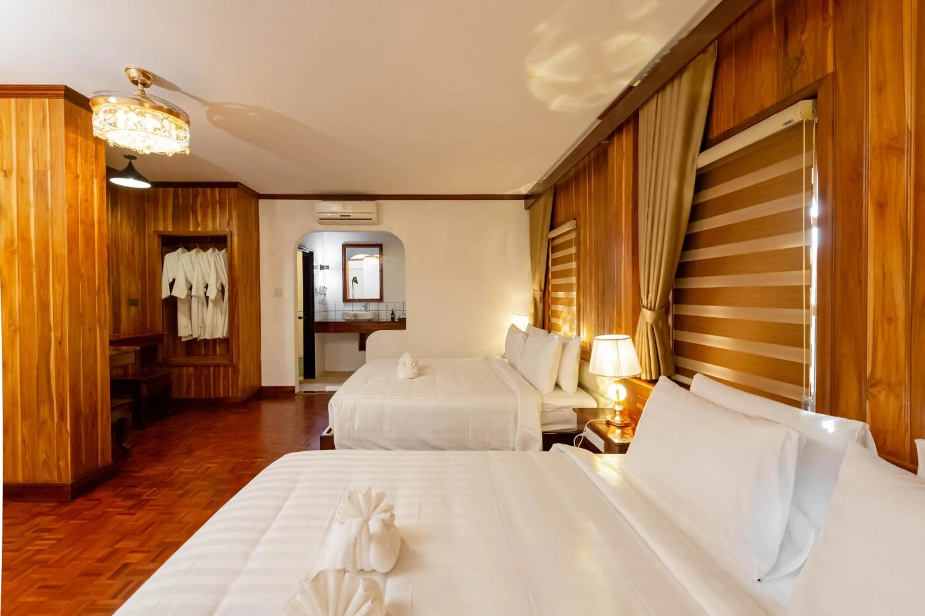 Photo of the whole room, Bed in LuangPrabang Center Hotel