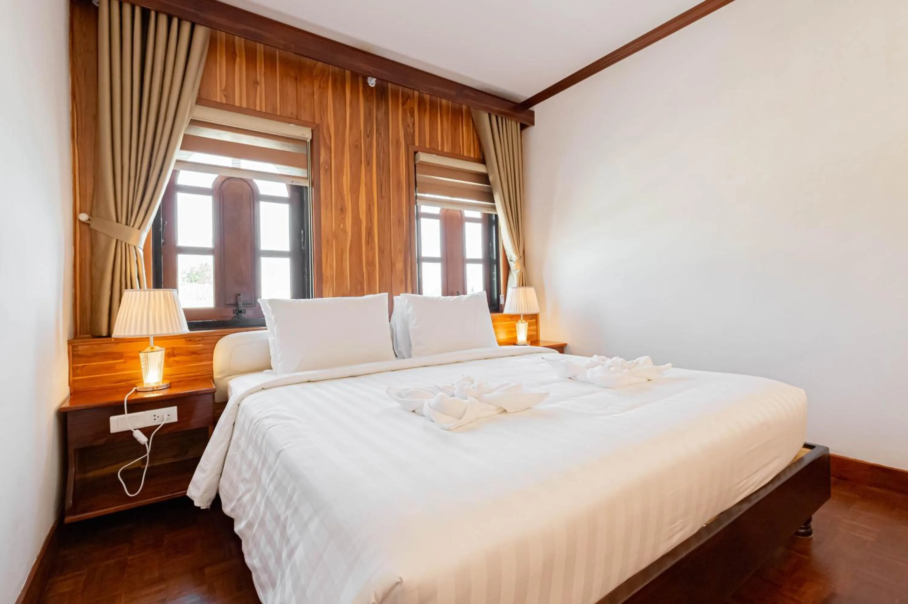 Photo of the whole room, Bed in LuangPrabang Center Hotel