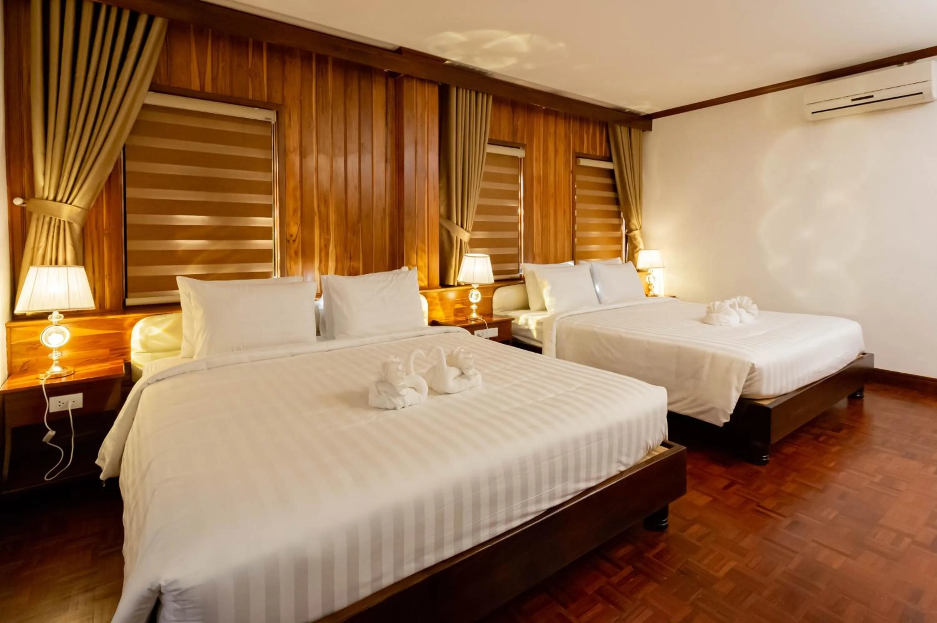 Photo of the whole room, Bed in LuangPrabang Center Hotel