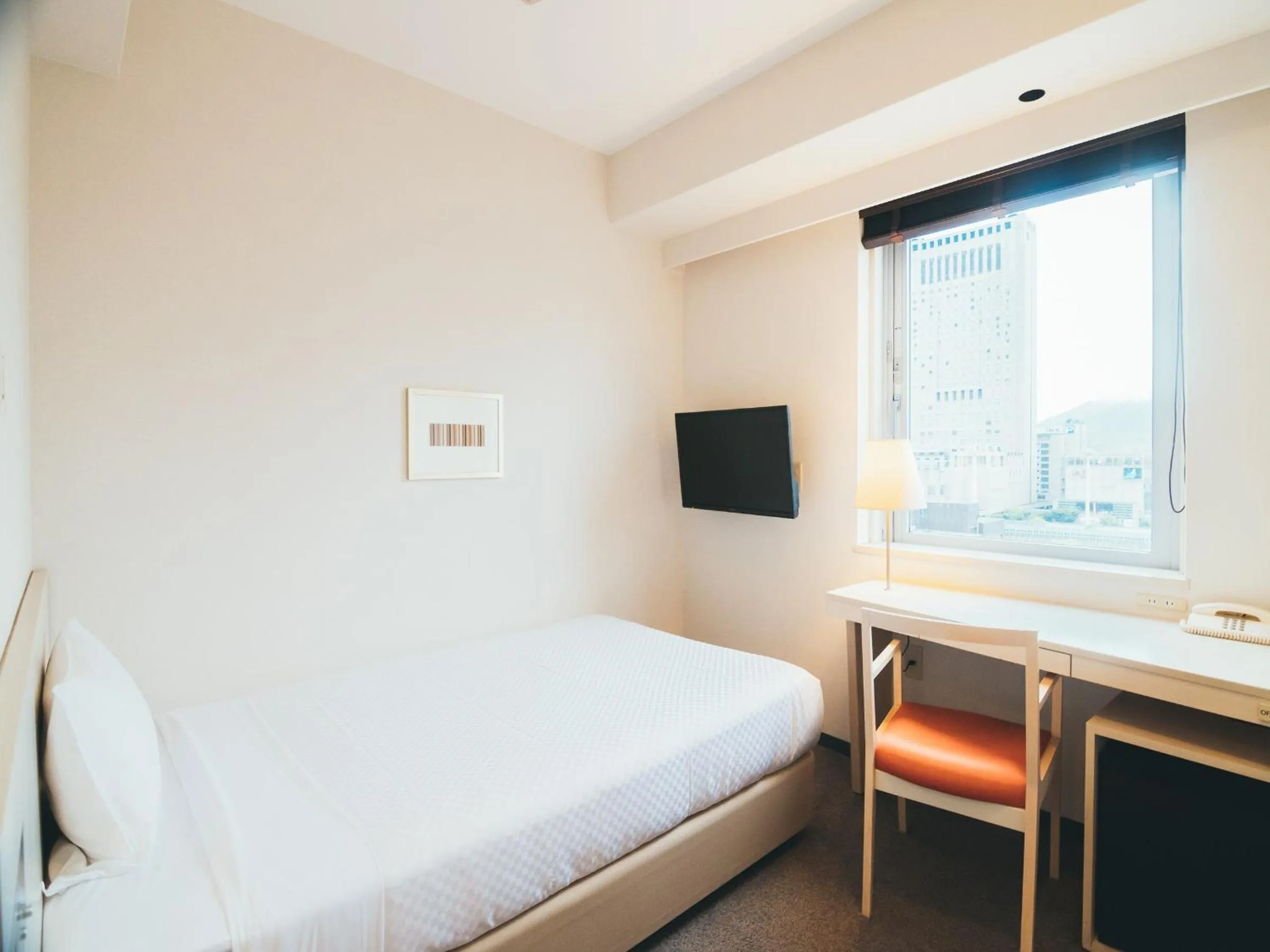 Photo of the whole room, Bed in Quintessa Hotel Kokura Comic & Books
