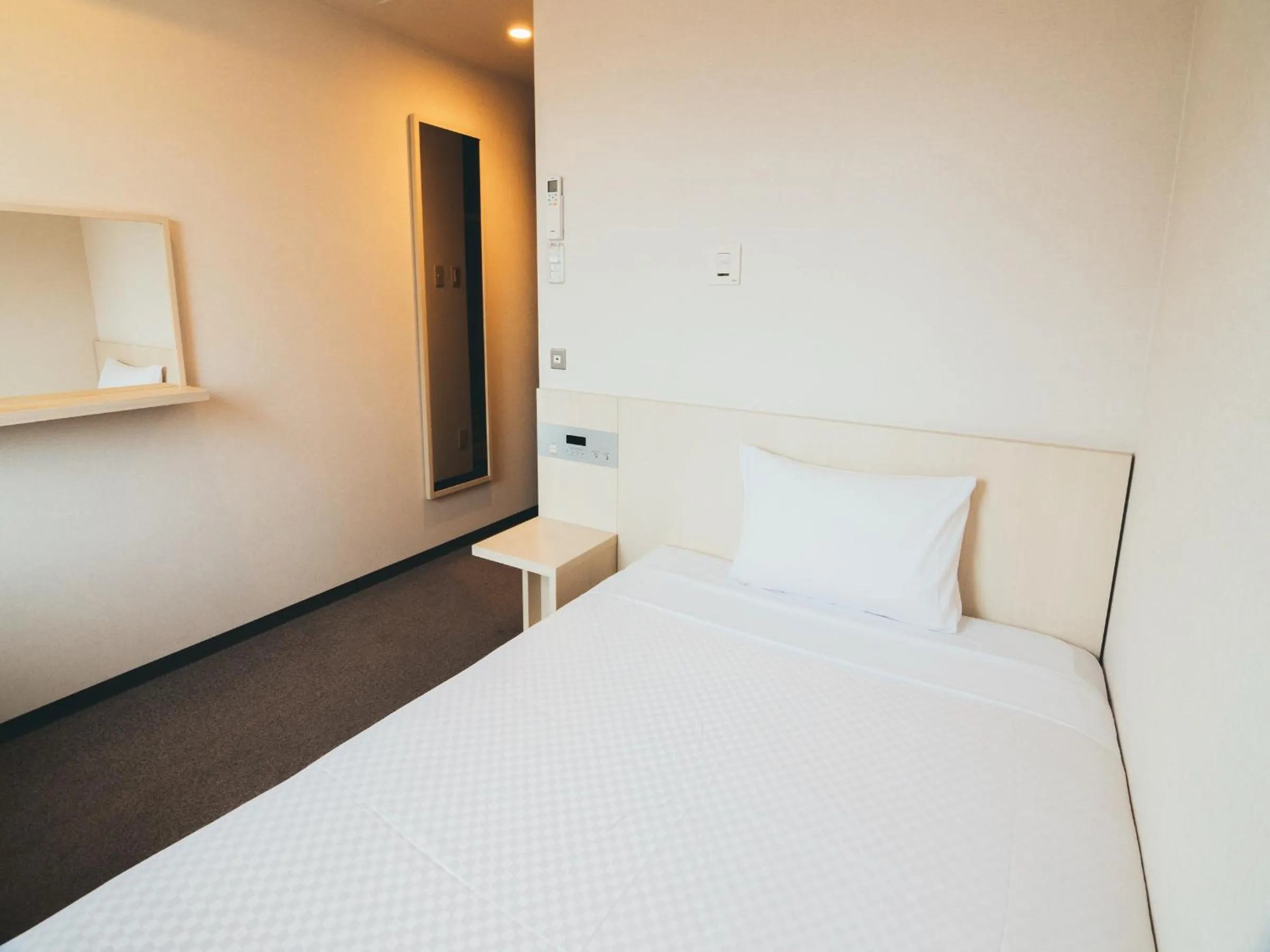 Photo of the whole room, Bed in Quintessa Hotel Kokura Comic & Books