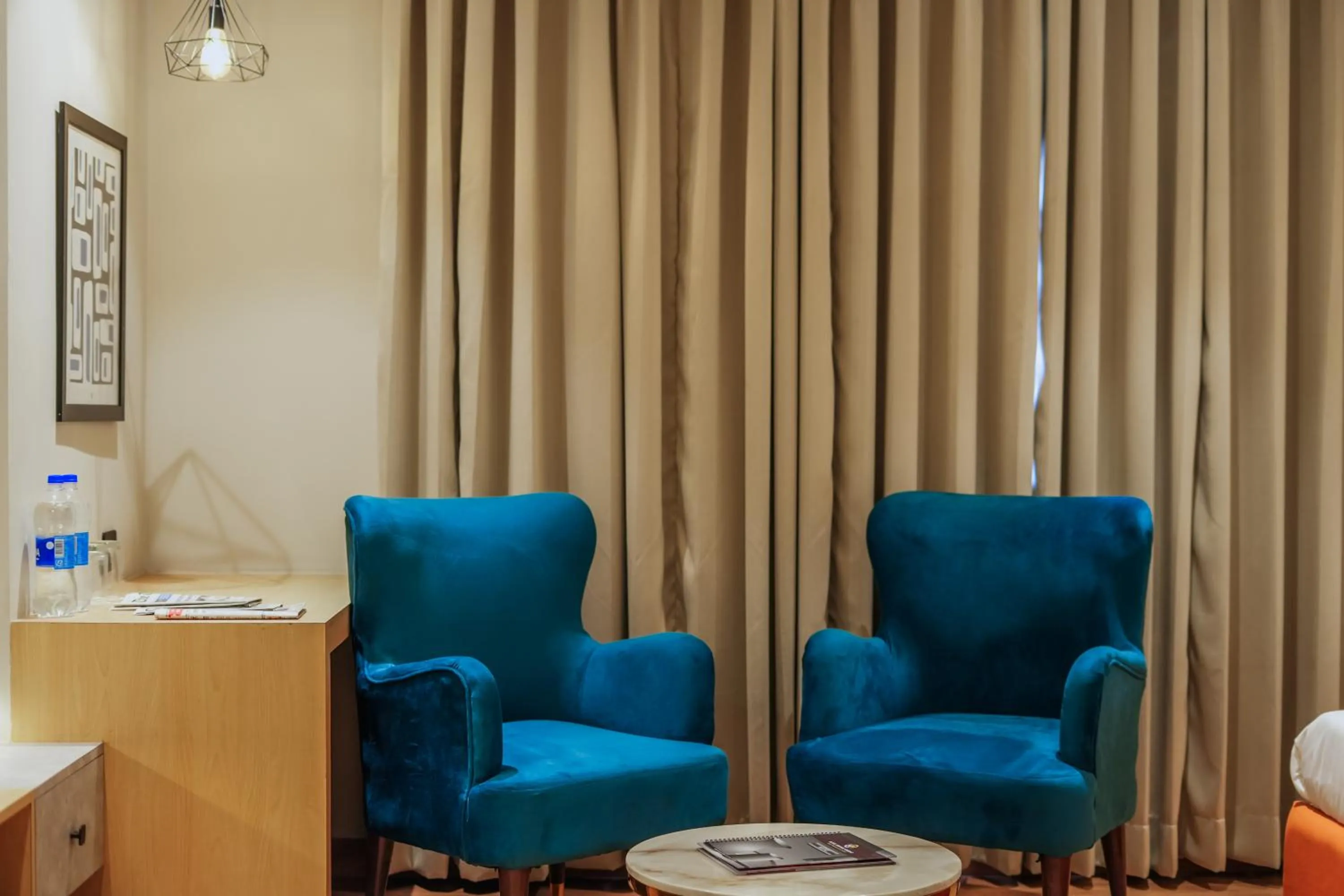 Seating area in Hotel Highway Greens Near VR Punjab Mall Airport Road Mohali Chandigarh