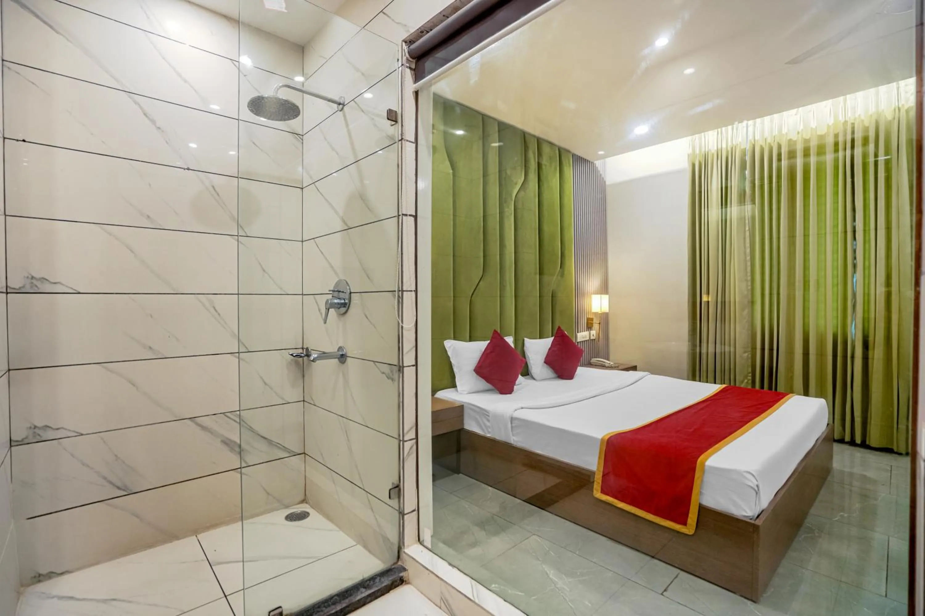 Shower, Bed in Hotel Highway Greens Near VR Punjab Mall Airport Road Mohali Chandigarh