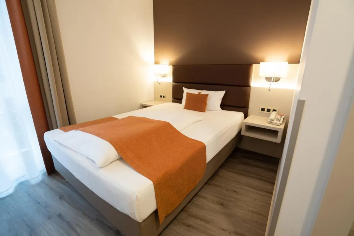 Bed in Hotel Kapuzinerhof