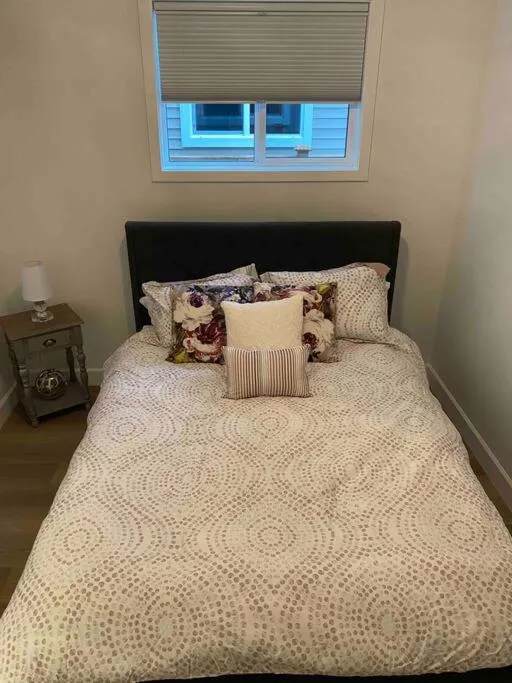 Bed in Adorable 1 Bedroom Suite- a skip to Galloping Goose