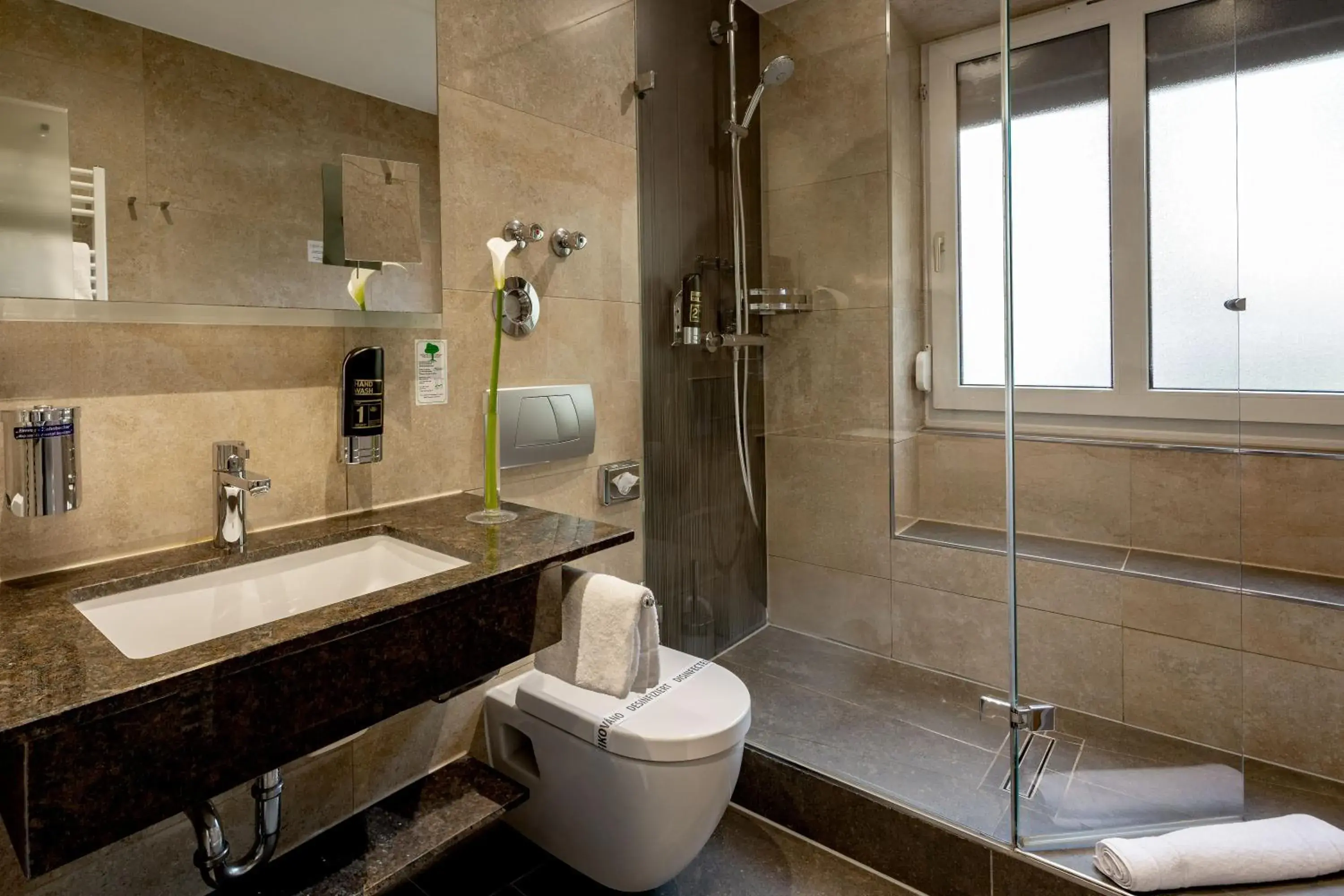 Bathroom in TIPTOP Hotel Burgschmiet Garni Bathroom in TIPTOP Hotel Burgschmiet Garni