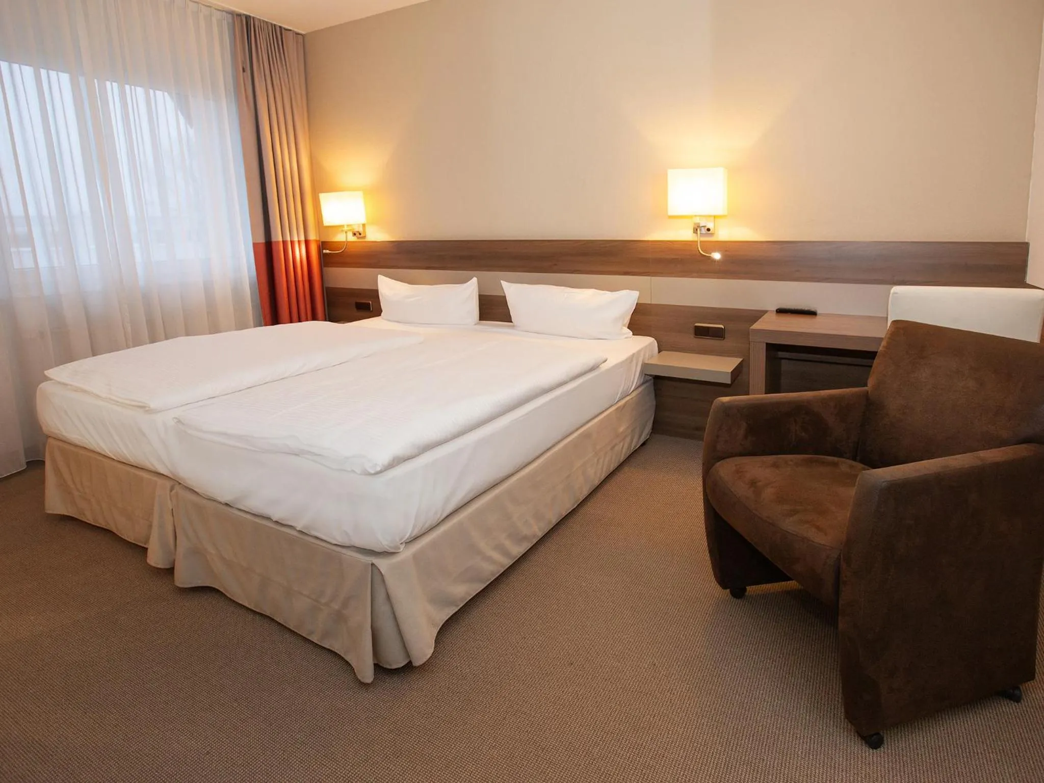Photo of the whole room, Bed in DORMERO Hotel Greifswald