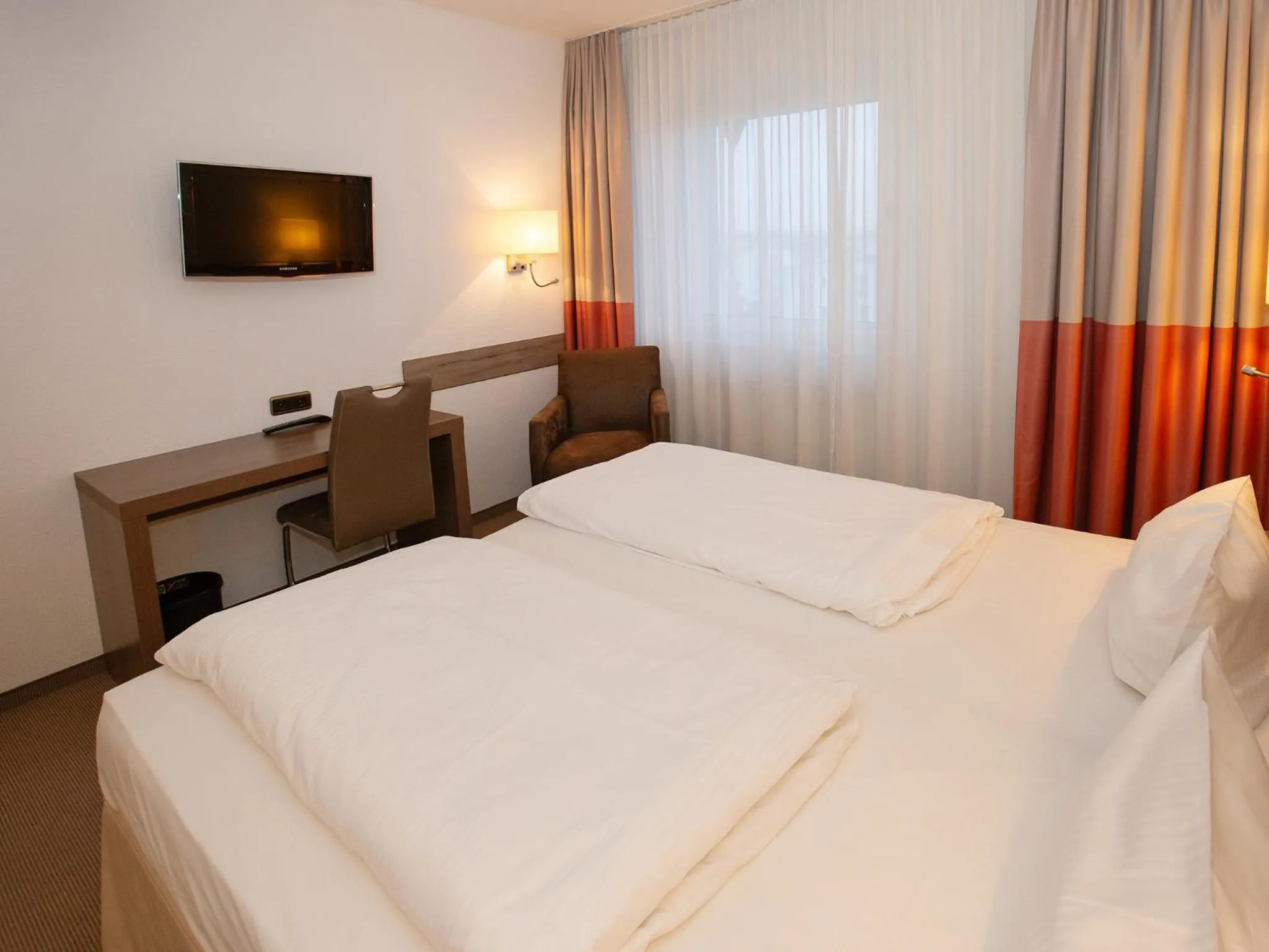 Photo of the whole room, Bed in DORMERO Hotel Greifswald